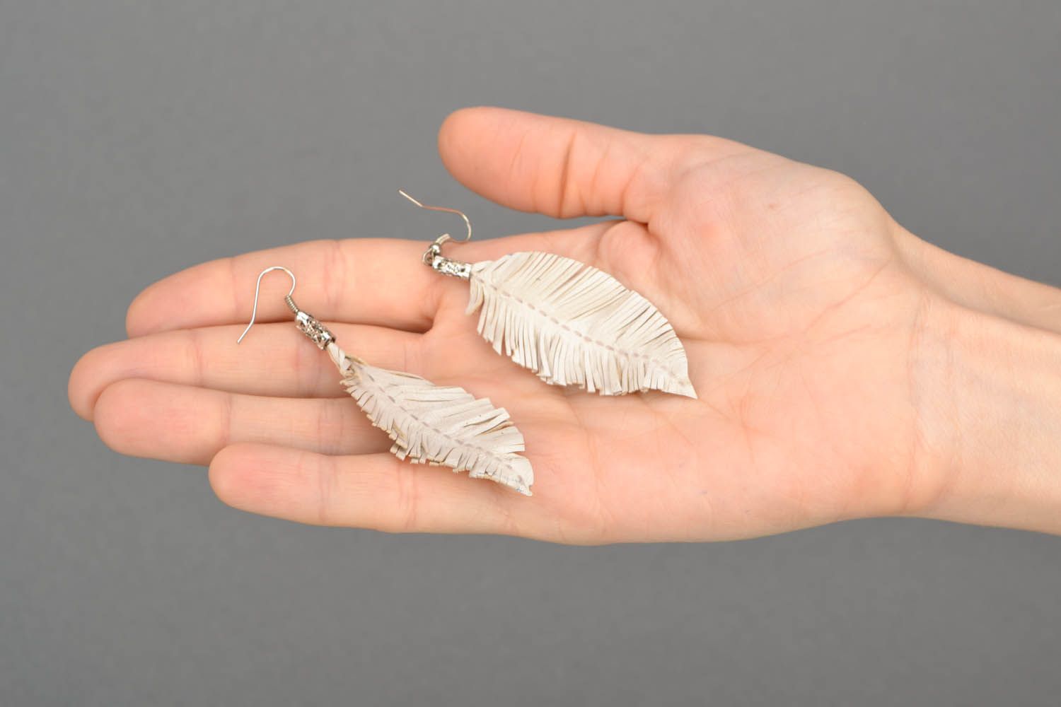 White leather earrings Feathers photo 2