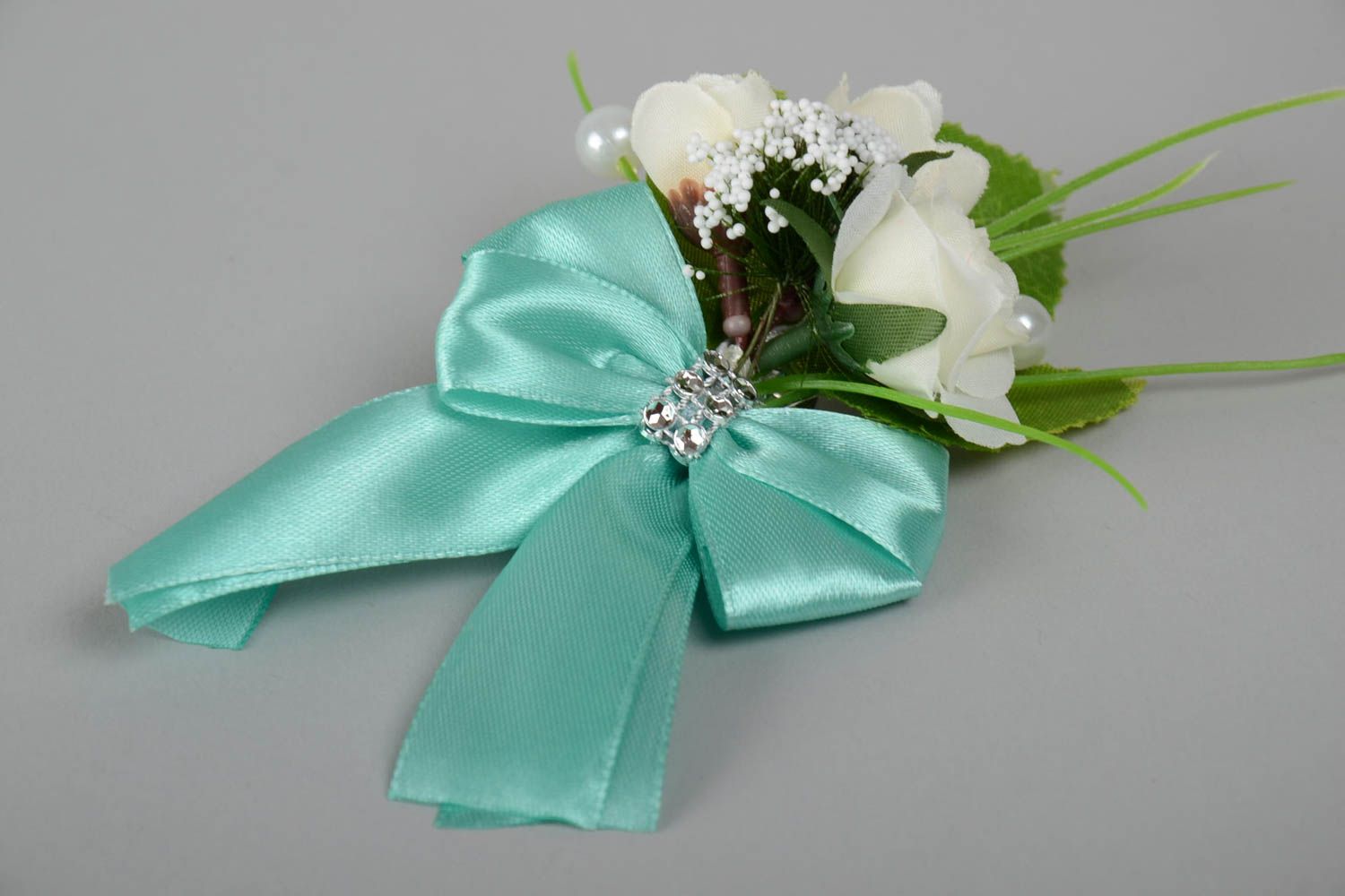 Beautiful handmade boutonniere for bride or groom of light color with flowers photo 2