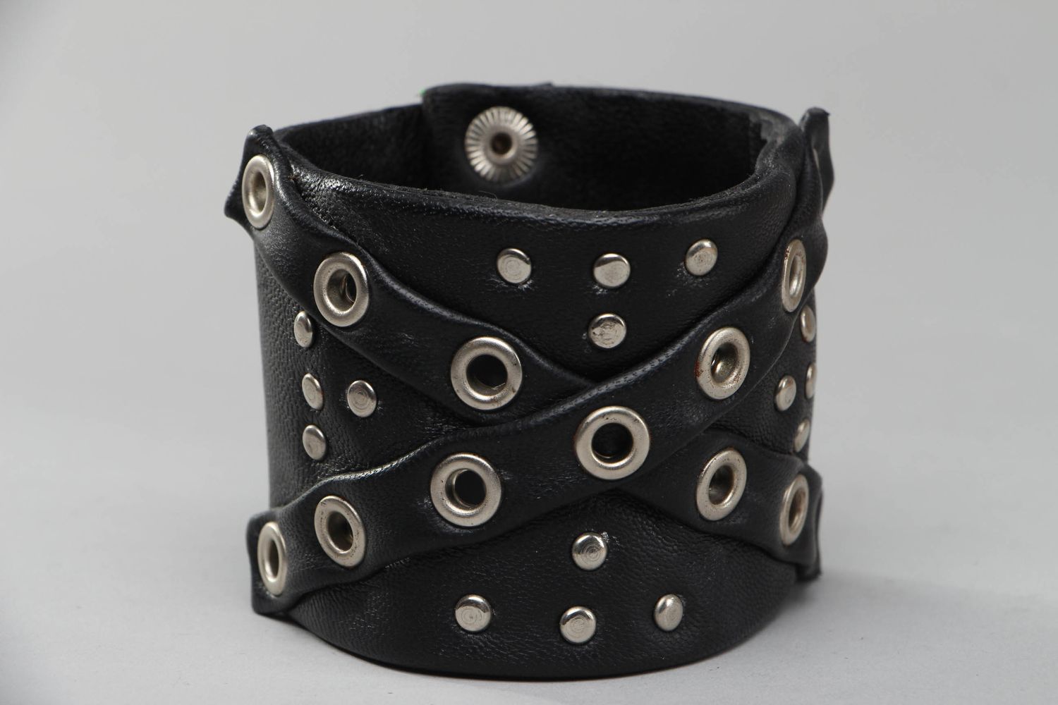 Wide leather bracelet with metal inserts photo 1