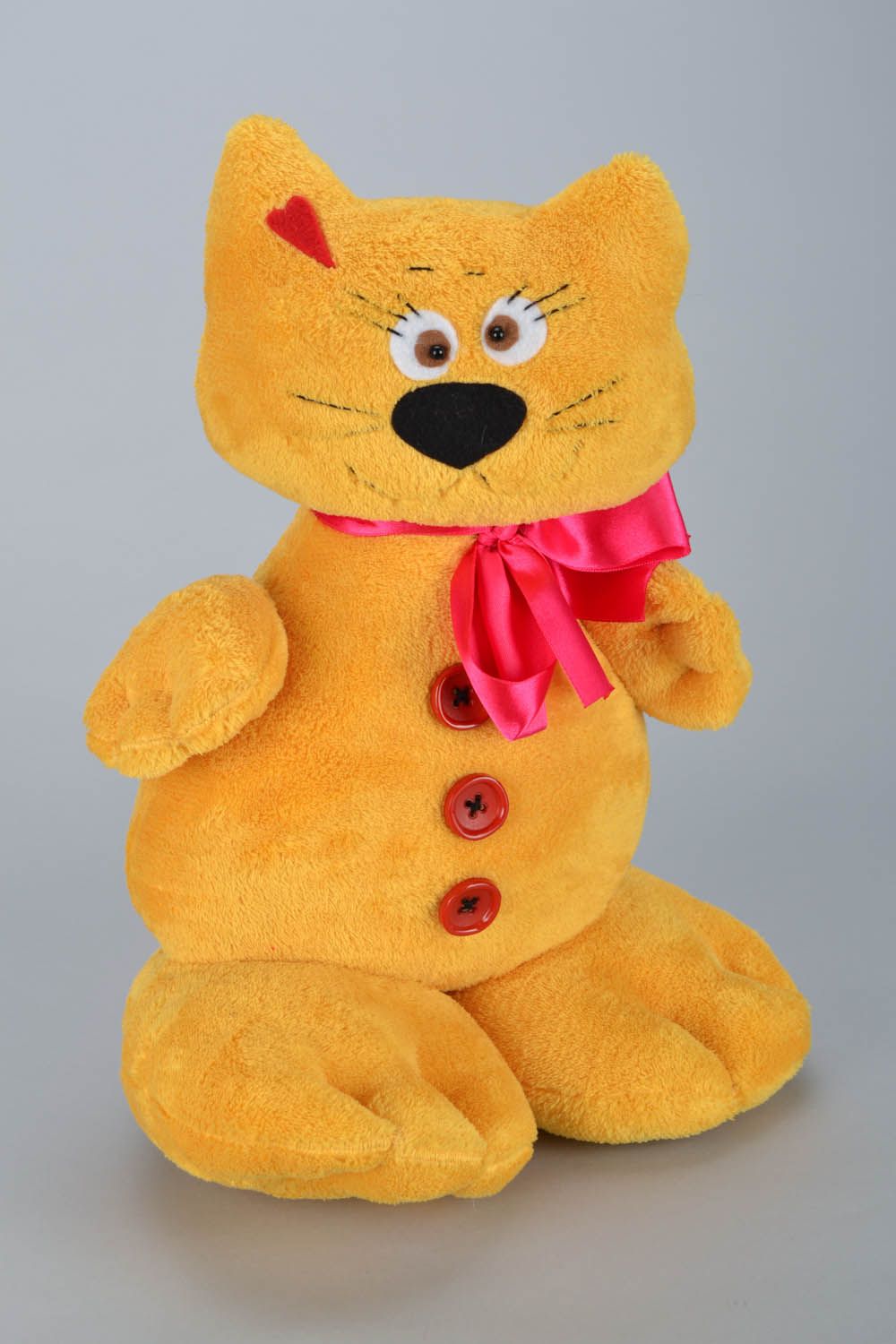 Brinquedo macio em forma do gato amarelo  foto 2