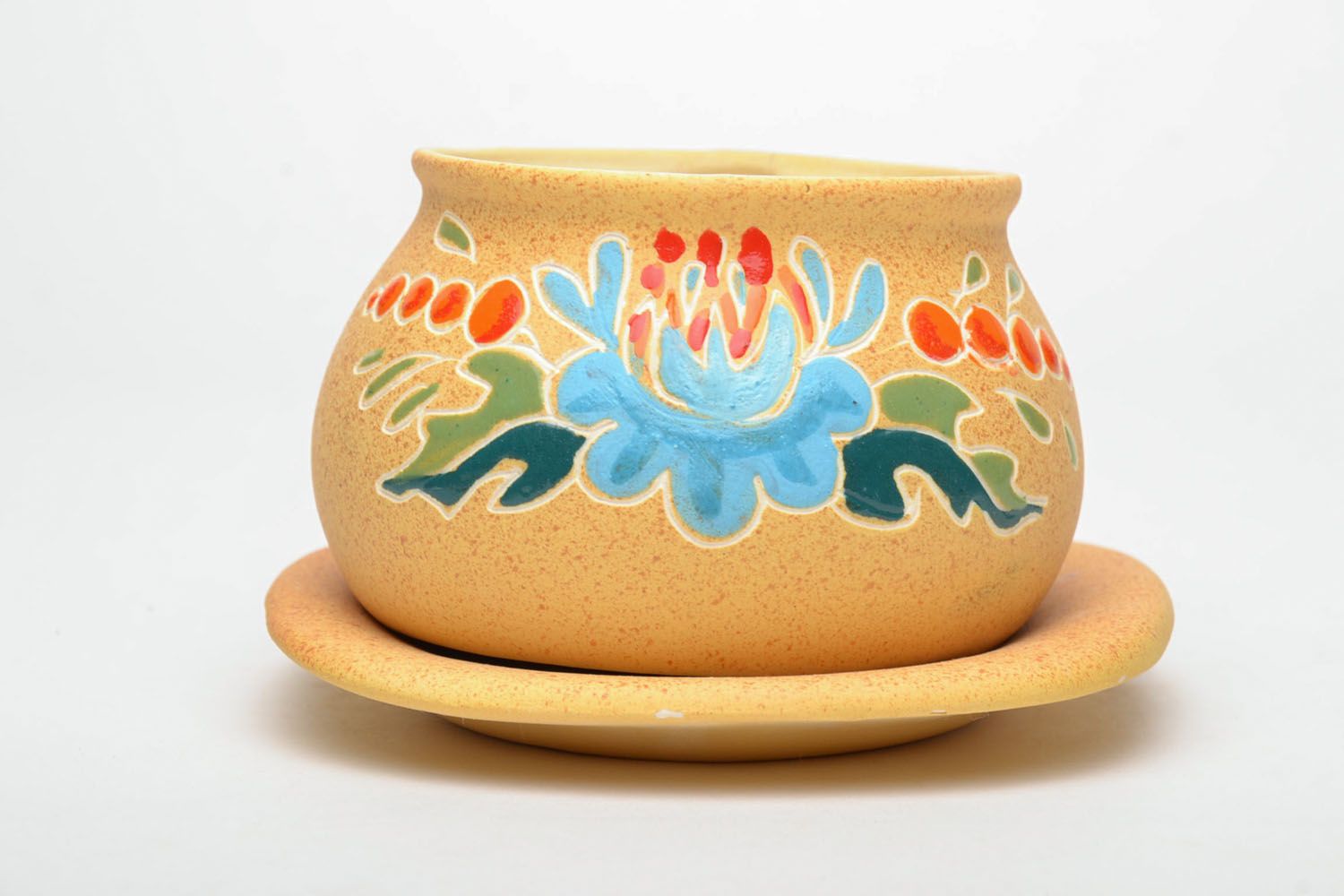 Art ceramic teacup with floral pattern in light yellow color with blue flower saucer and handle photo 2