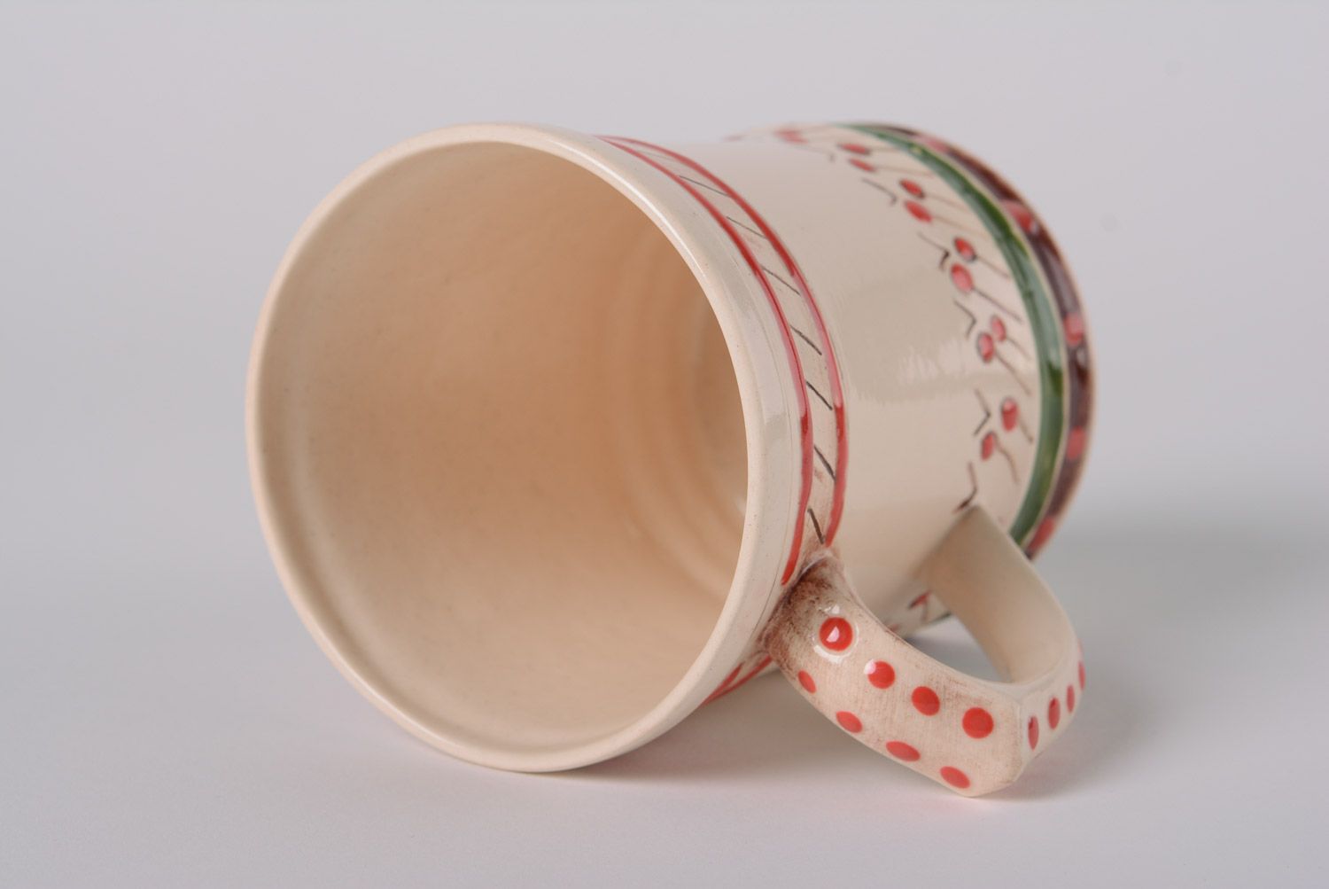 Glazed maiolica ceramic cup painted with red and green dots in the Ukrainian style photo 4