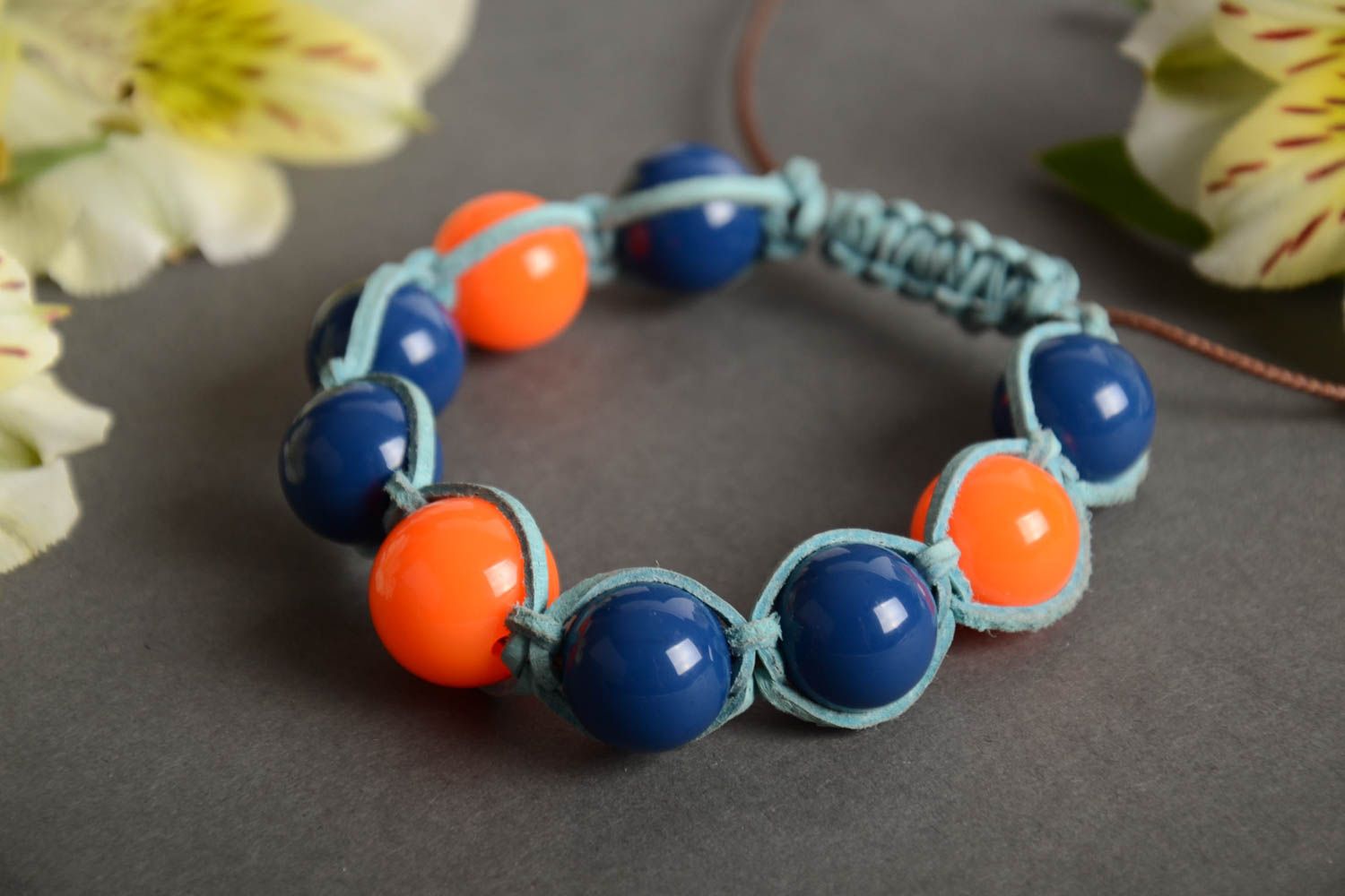 Handmade wrist bracelet woven of blue waxed cord and colorful plastic beads photo 1