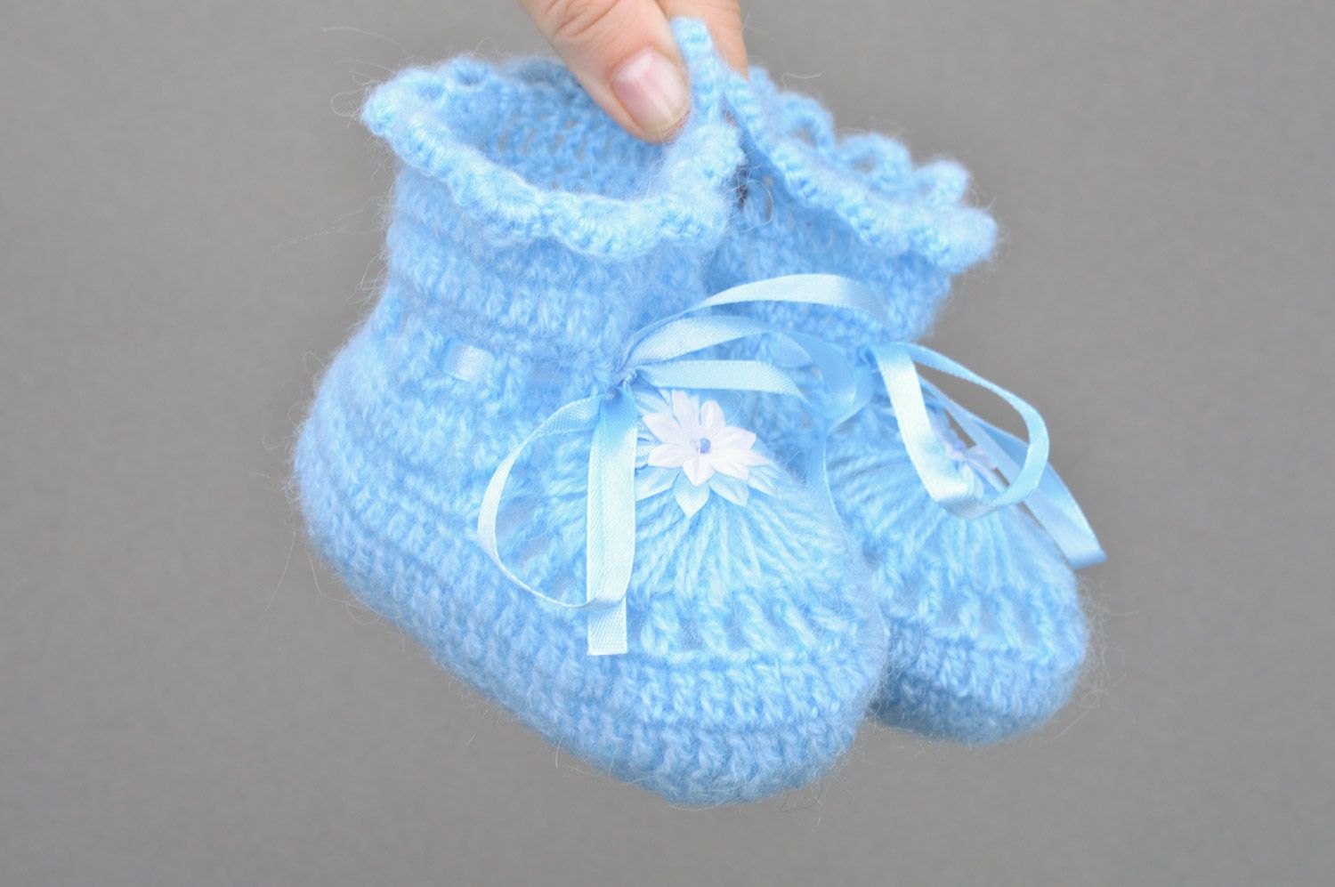 Handmade crocheted blue baby booties made of acrylic yarns with ribbon for a boy photo 3