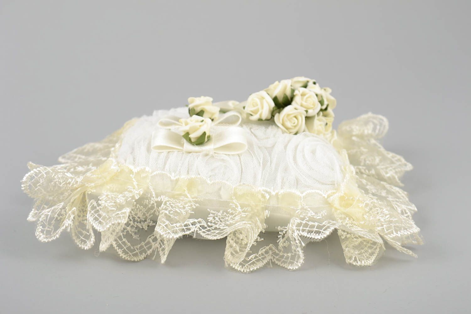 Handmade decorative fabric ring pillow with cream lace and artificial flowers photo 4