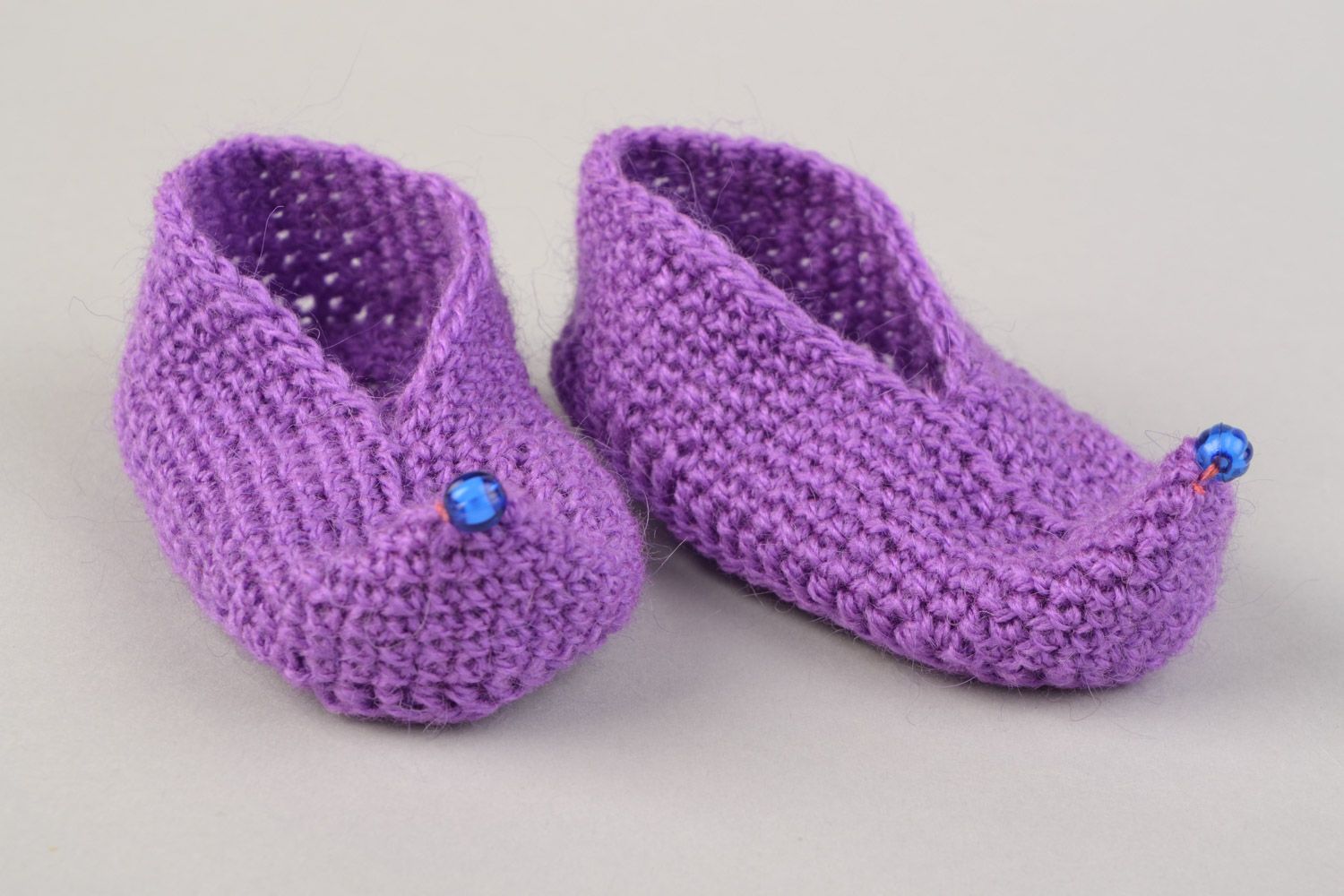 Handmade soft and warm baby shoes crocheted of angora wool of violet color photo 1