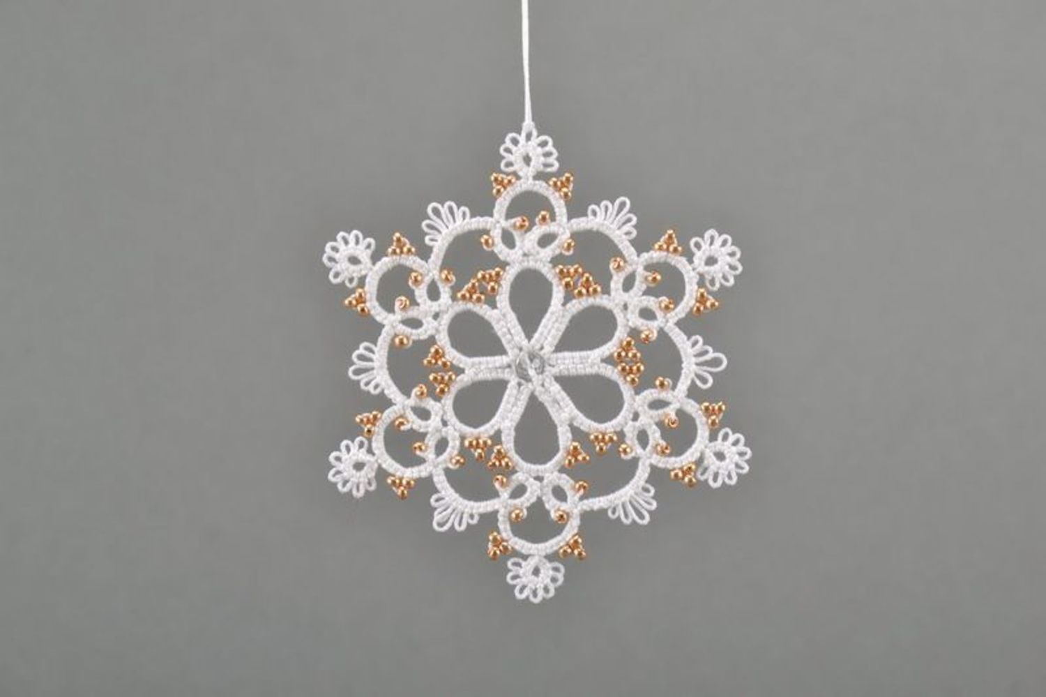 Christmas tree lace decoration in the form of a snowlake photo 2