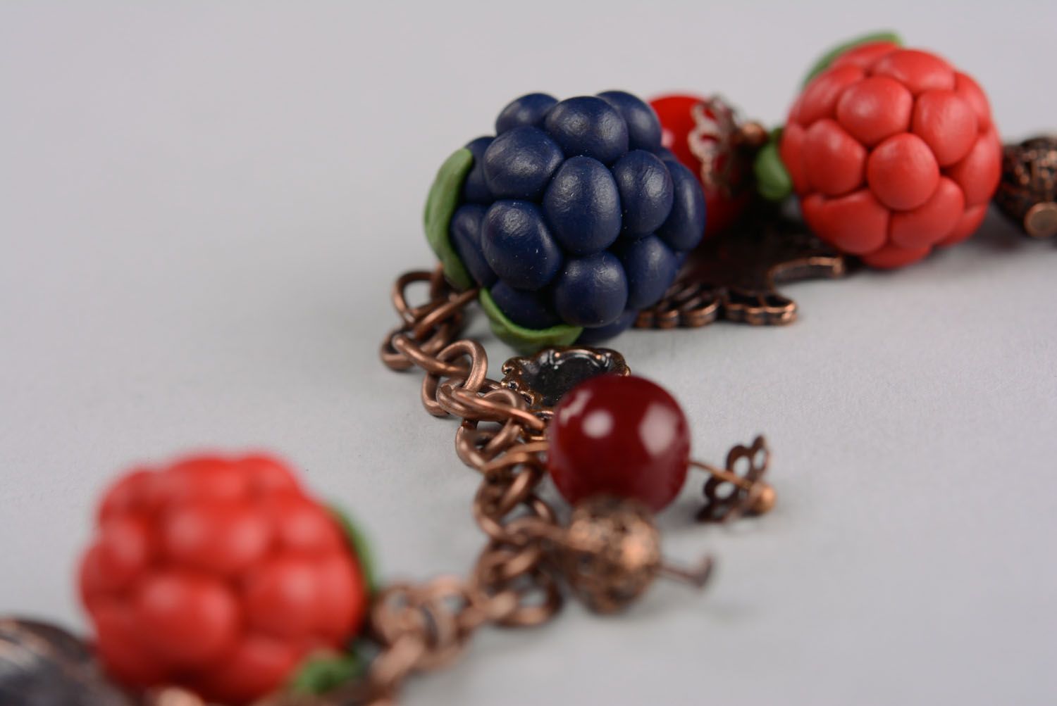 Plastic bracelet with charms in the shape of berries photo 4