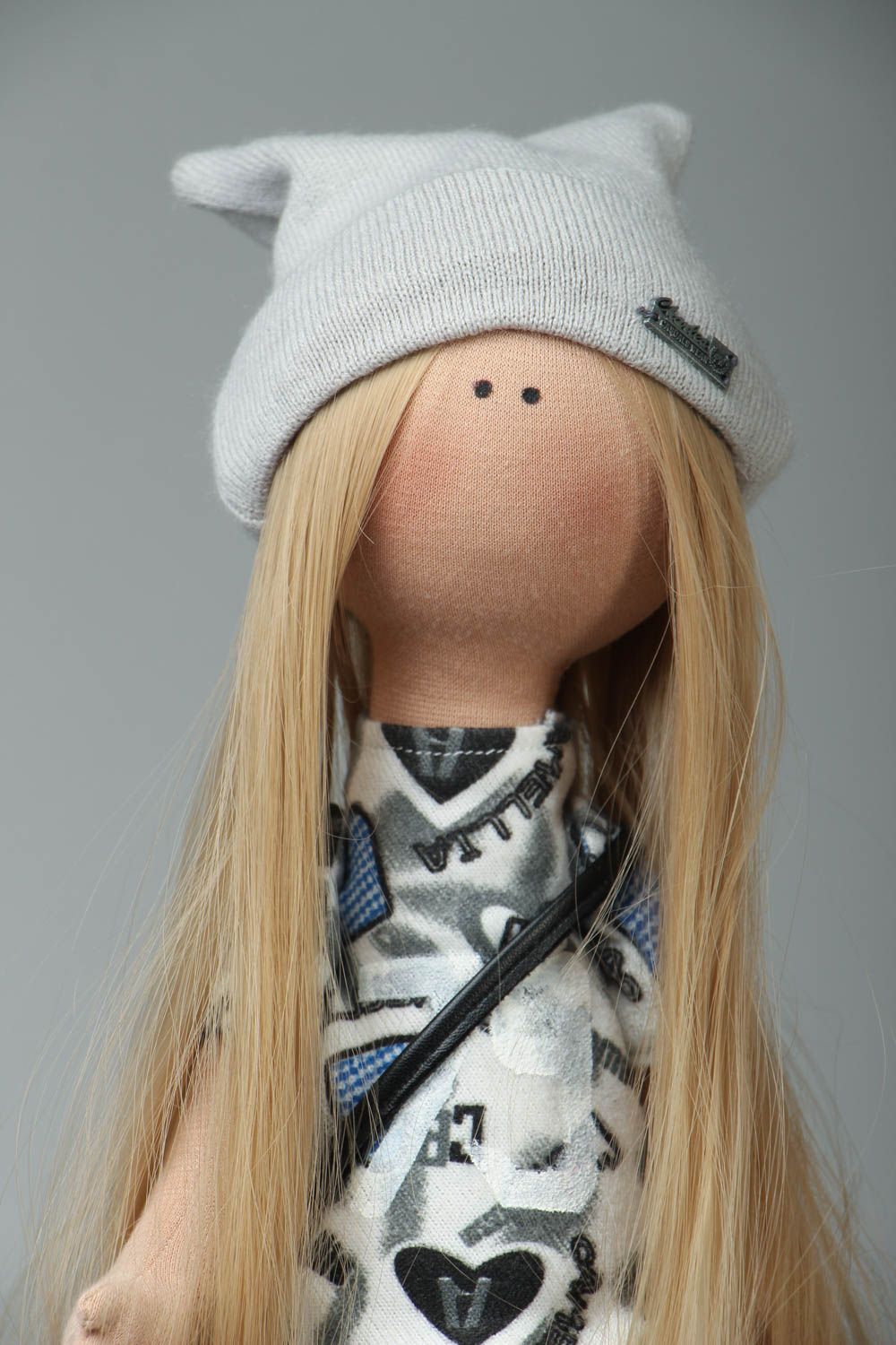Soft doll with a hat photo 2