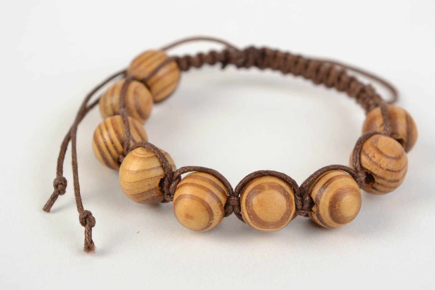 Handmade designer woven cotton cord bracelet with wooden beads photo 1