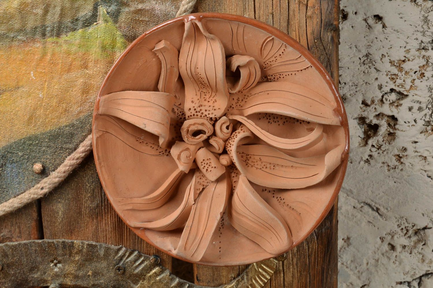 Beautiful decorative round handmade clay plate with molded flower photo 1