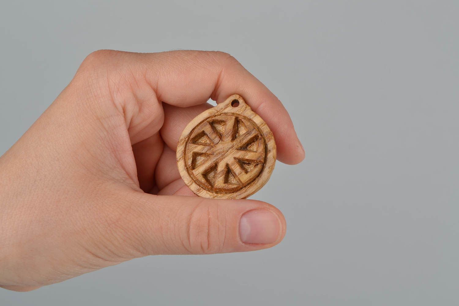 Handmade carved small round wooden neck pendant with Slavic symbol Kolovrat photo 2