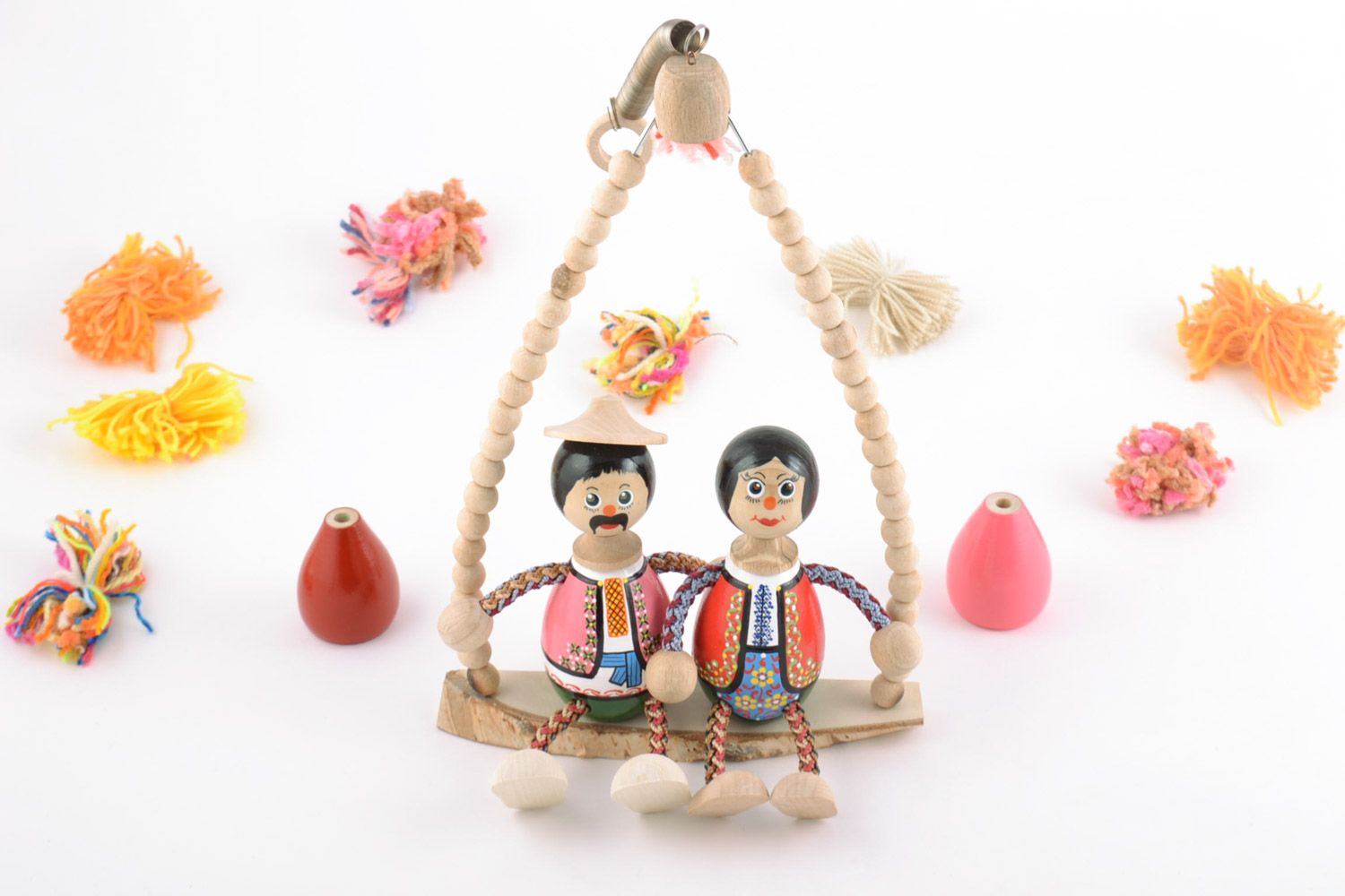 Handmade painted interior wooden toy wife and husband sitting on bench photo 1