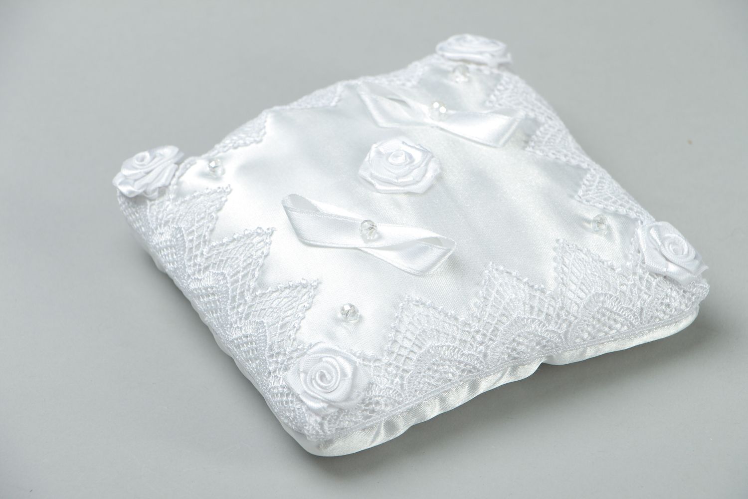 White satin wedding ring pillow photo 1