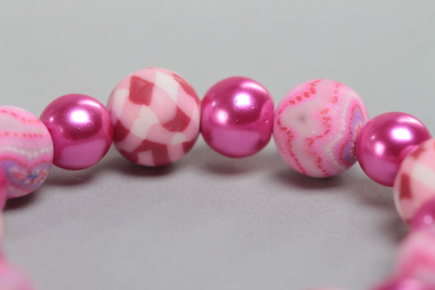 Pink children's handmade designer plastic bracelet with beads on elastic band photo 4