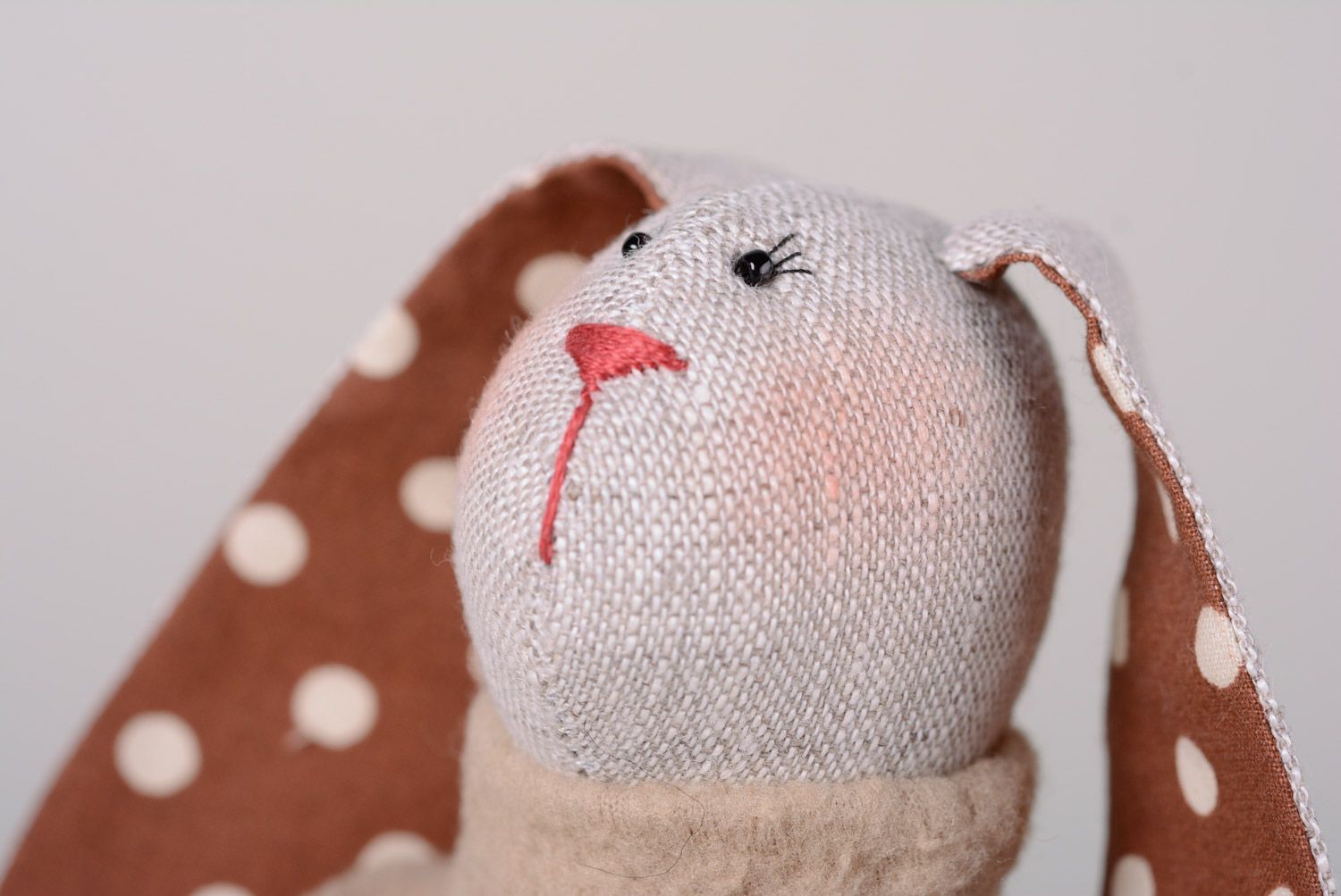 Handmade designer soft toy rabbit sewn of natural fabrics in polka dot dress photo 2