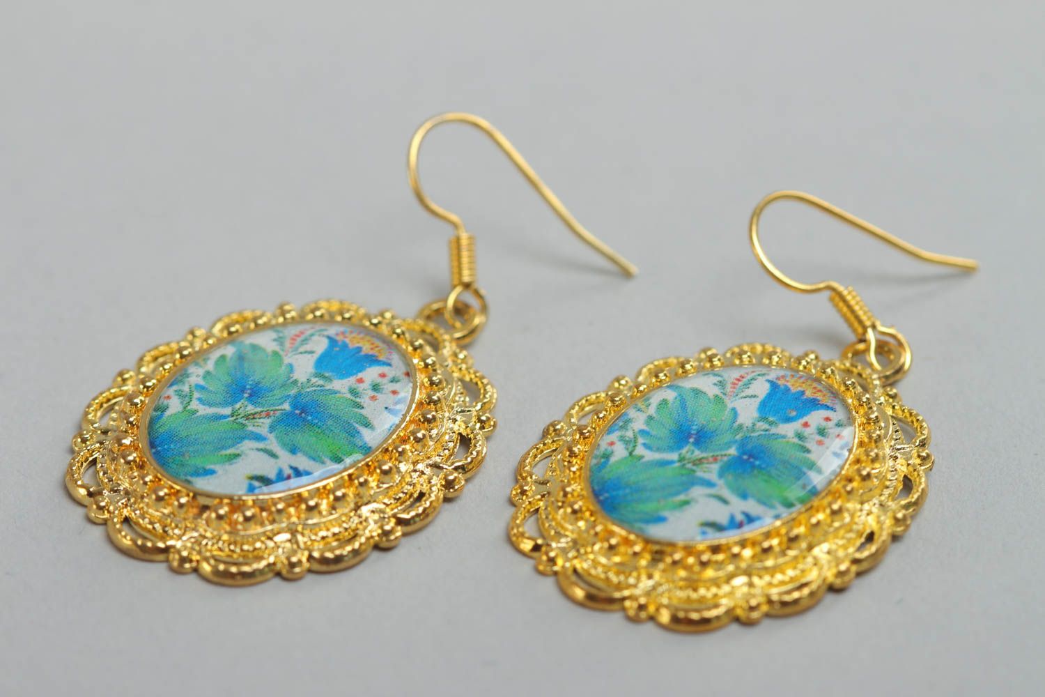 Handmade oval floral earrings with golden colored metal basis and glass glaze photo 3