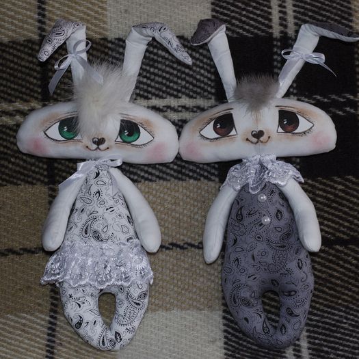 Pair of handmade soft toys sewn of fabric in the shape of rabbits for Easter photo 2