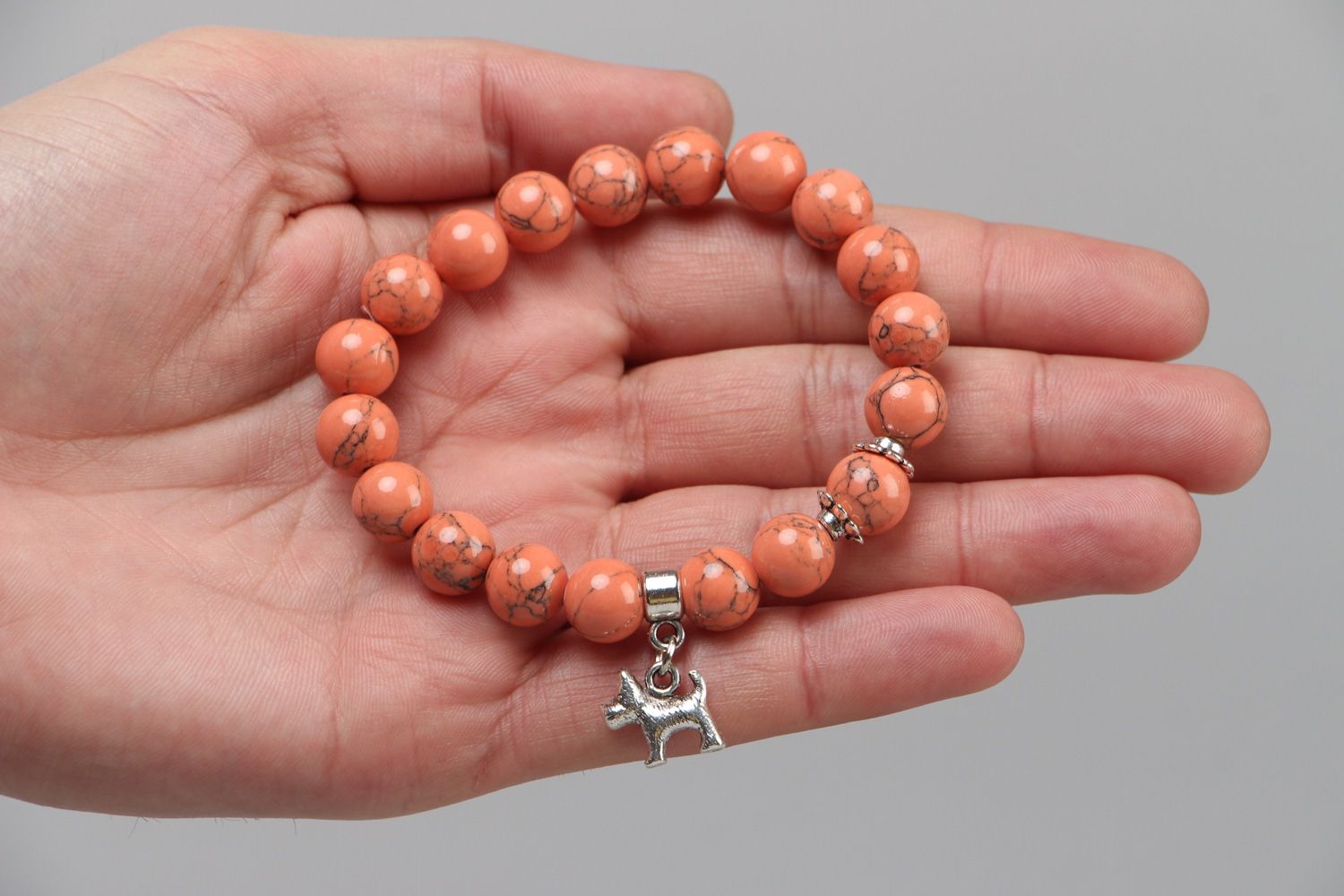Cute handmade stretch wrist bracelet with natural coral beads and metal charm  photo 3