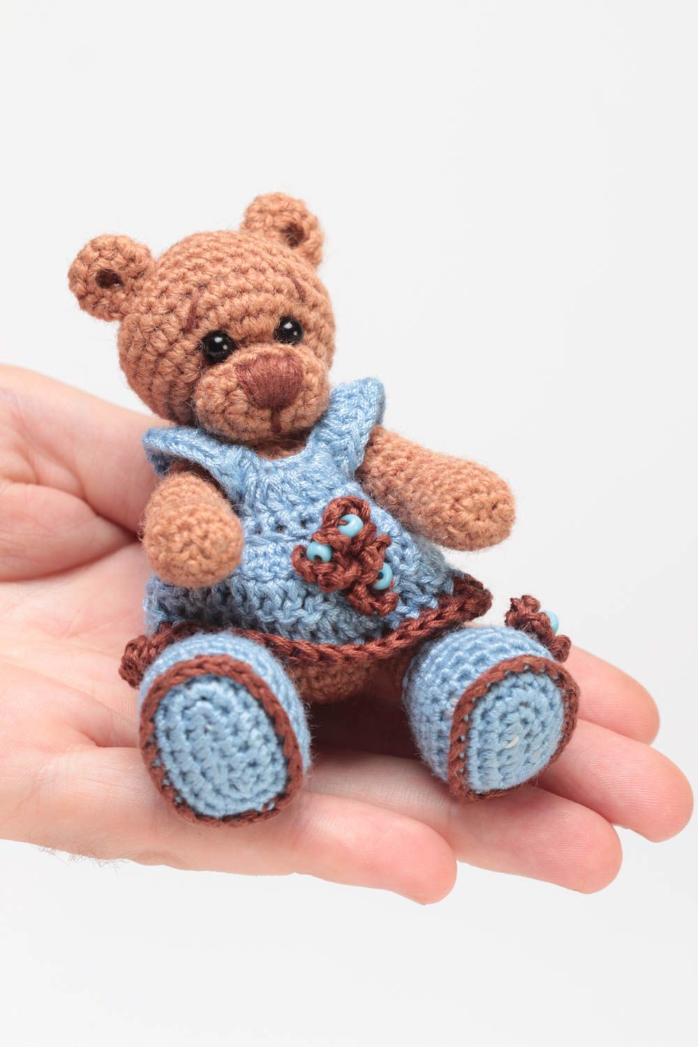 Handmade small crocheted soft toy brown bear girl in blue dress and shoes  photo 5