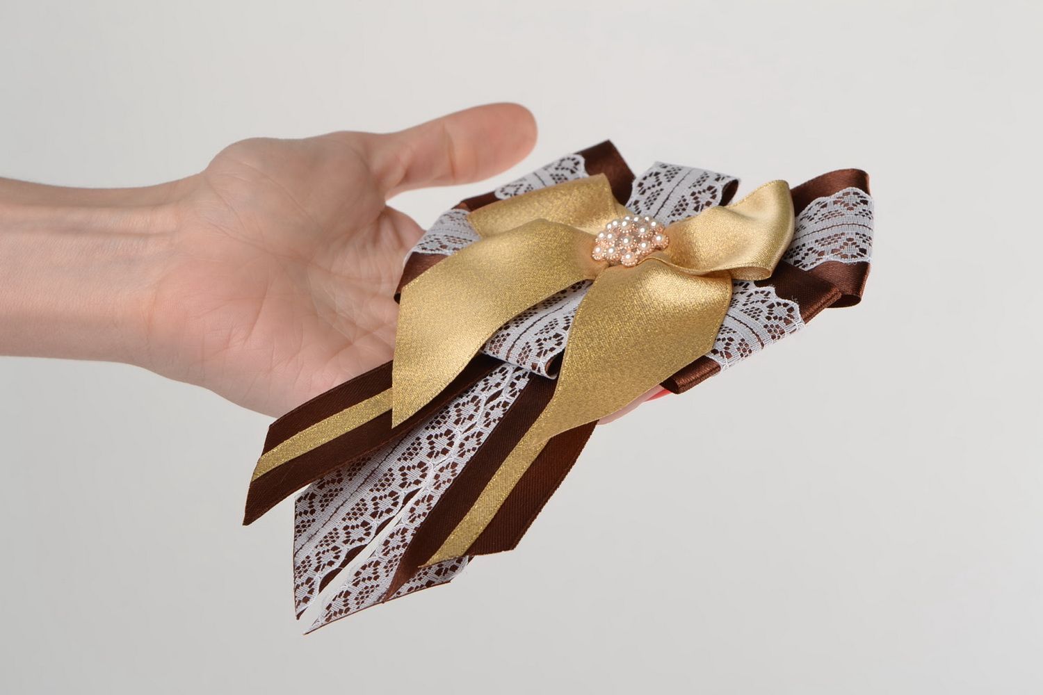 Handmade designer satin ribbon brooch in the shape of bow in brown color palette photo 2