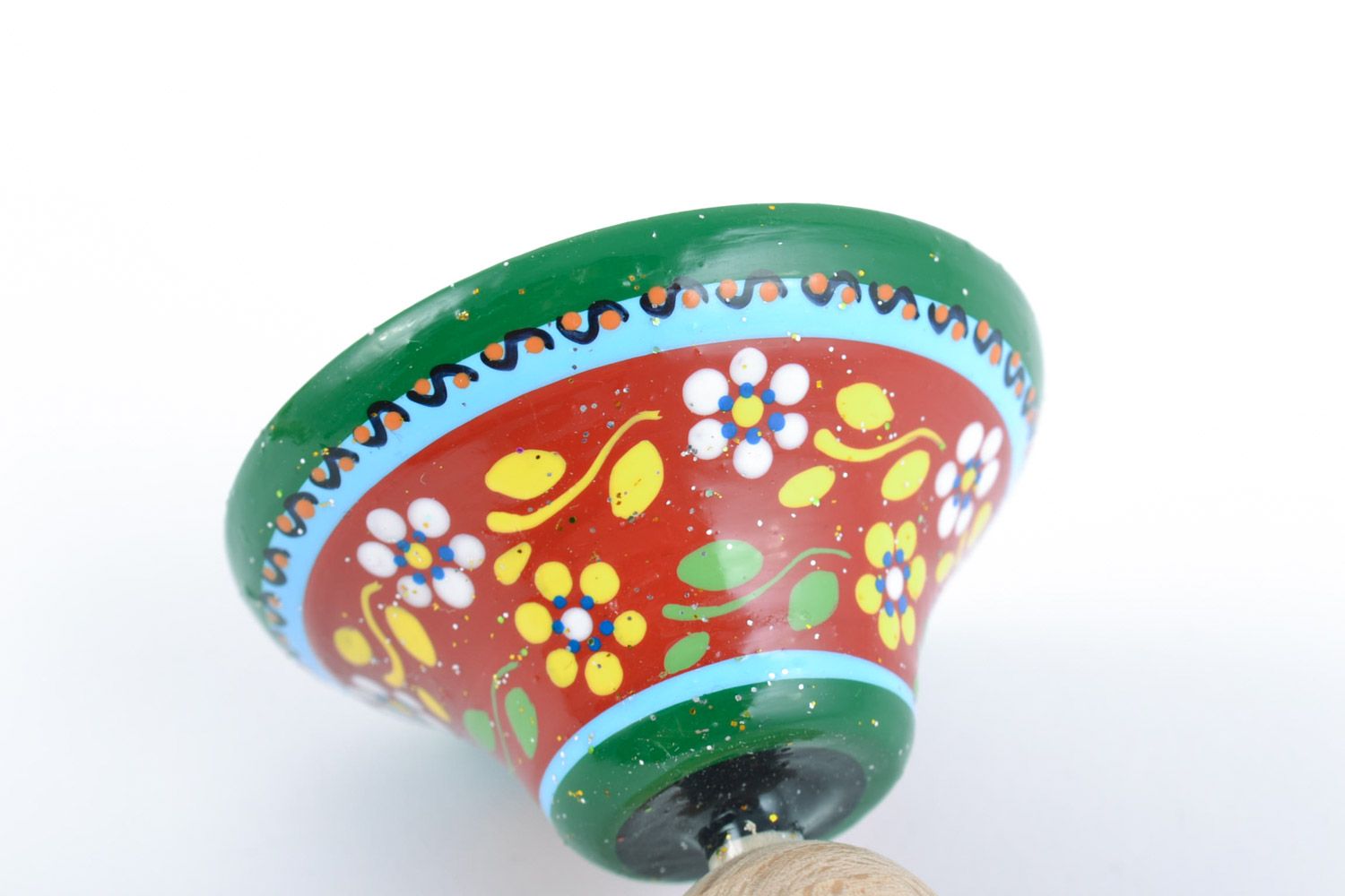 Small handmade decorative beautiful wooden spinning top with painted ornaments photo 4