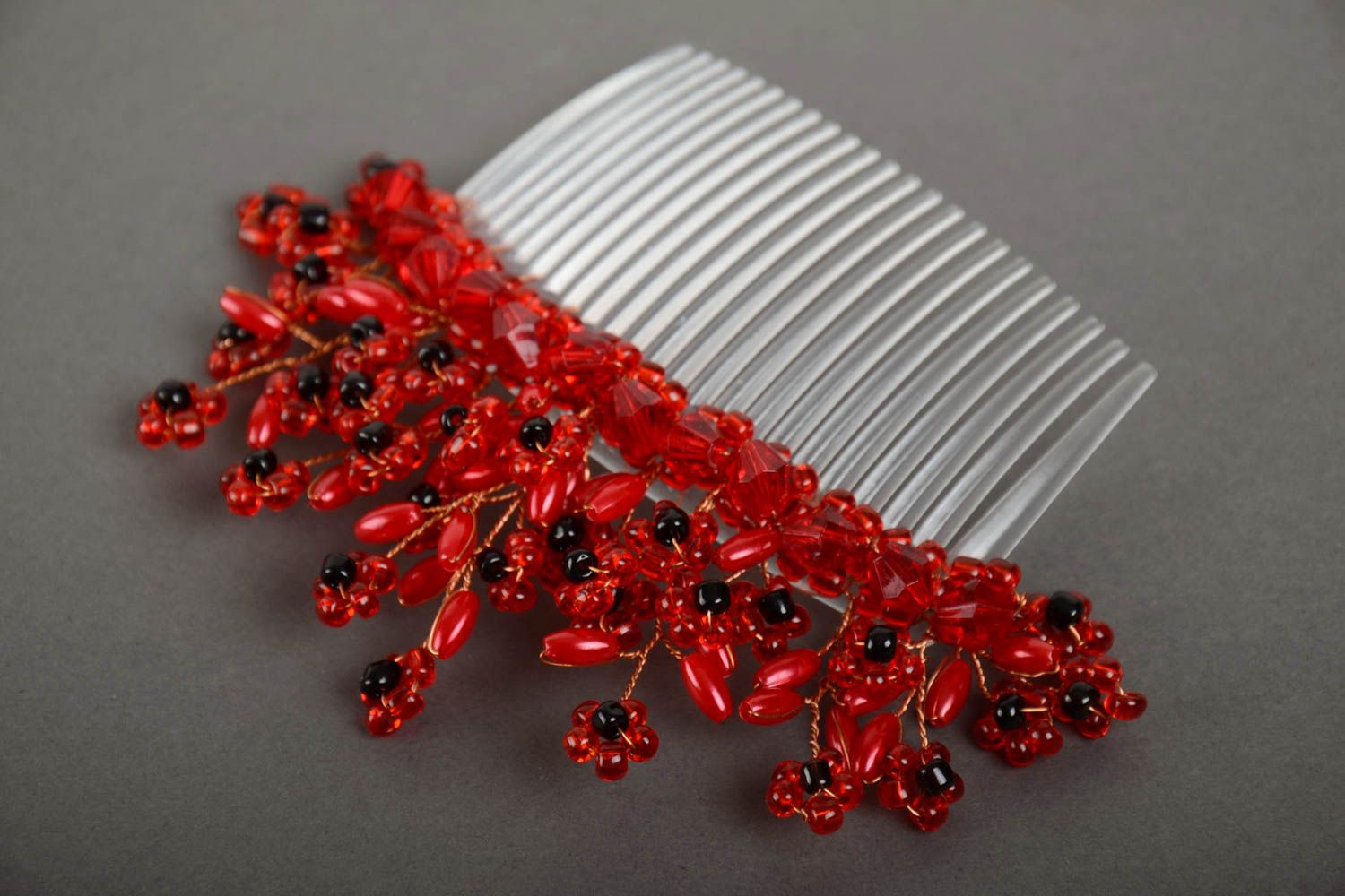 Handmade decorative plastic hair comb with beaded flowers of red color photo 2