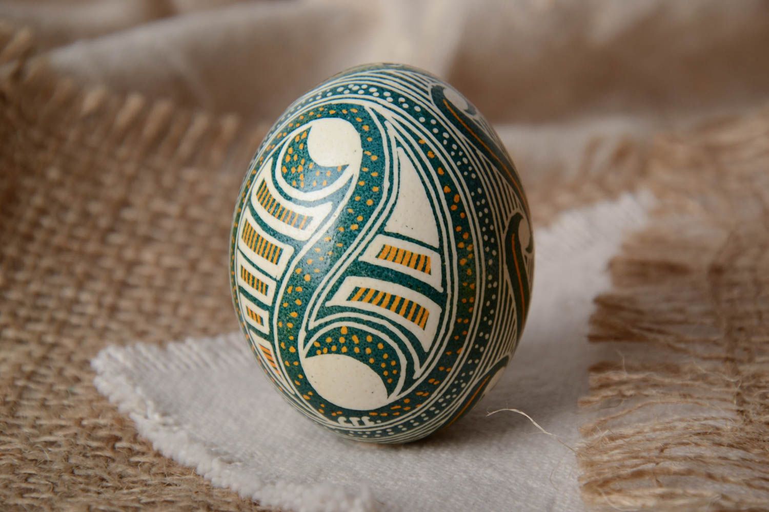 Handmade decorative chicken egg painted in green color shades Easter pysanka photo 1