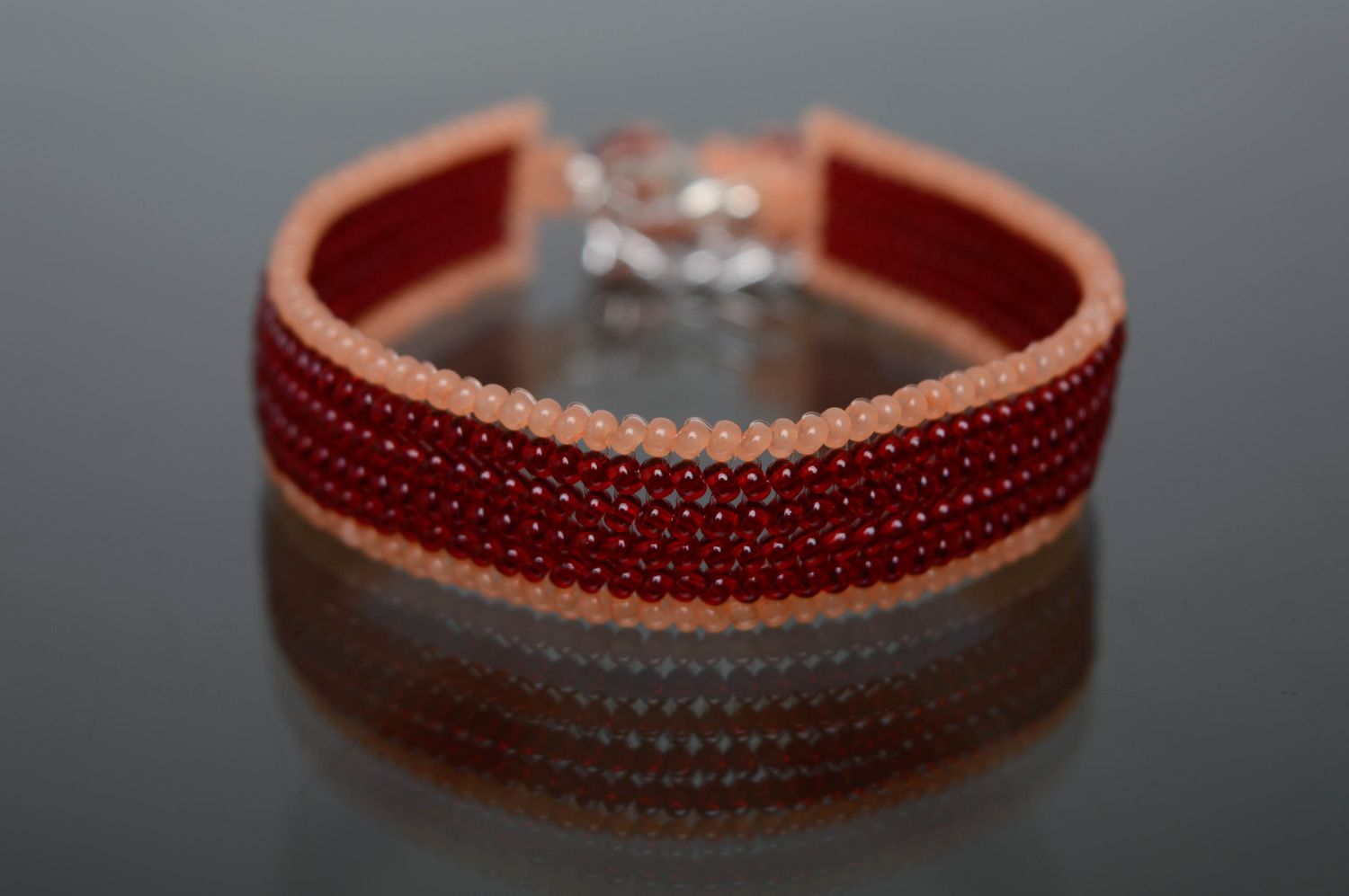 Dark red plain beaded bracelet with charm photo 1