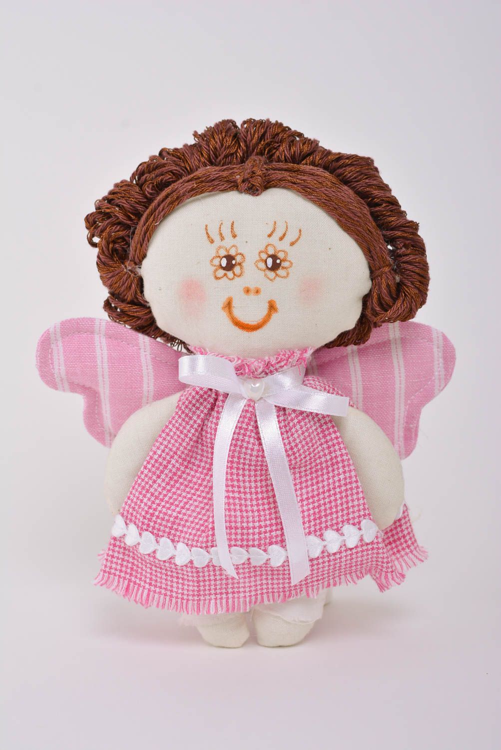 Handmade soft toy sewn of cotton fabric in the shape of angel girl in pink dress photo 1