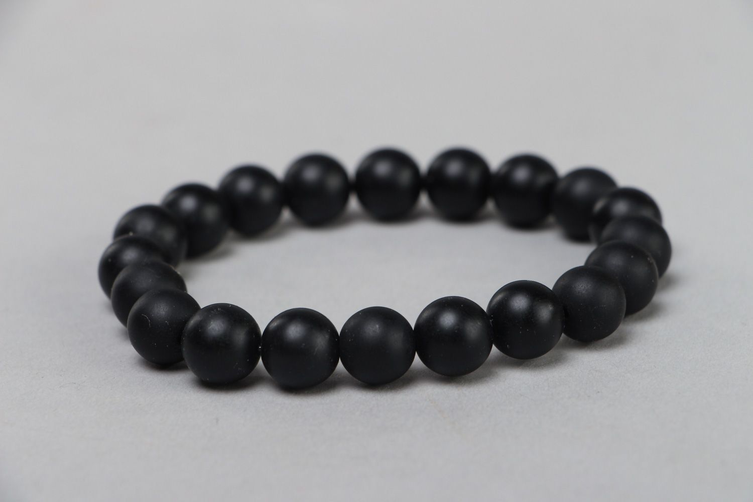 Handmade wrist stretch bracelet with natural stone beads of black color photo 2