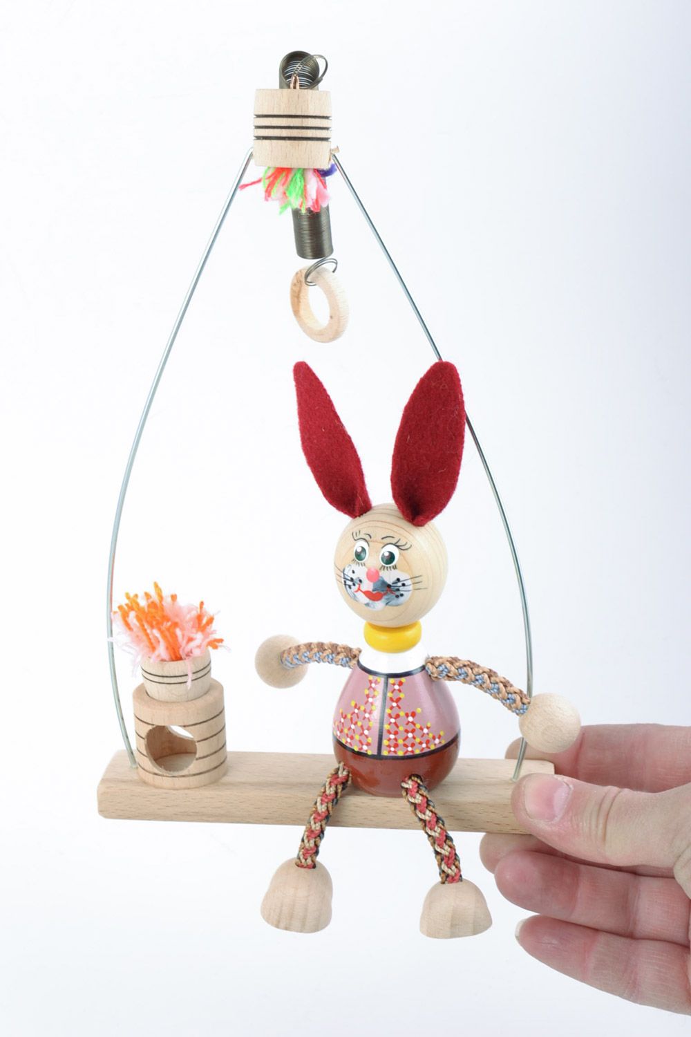 Деревянная игрушка заяц на лавке ручной работы с росписью фото 1
