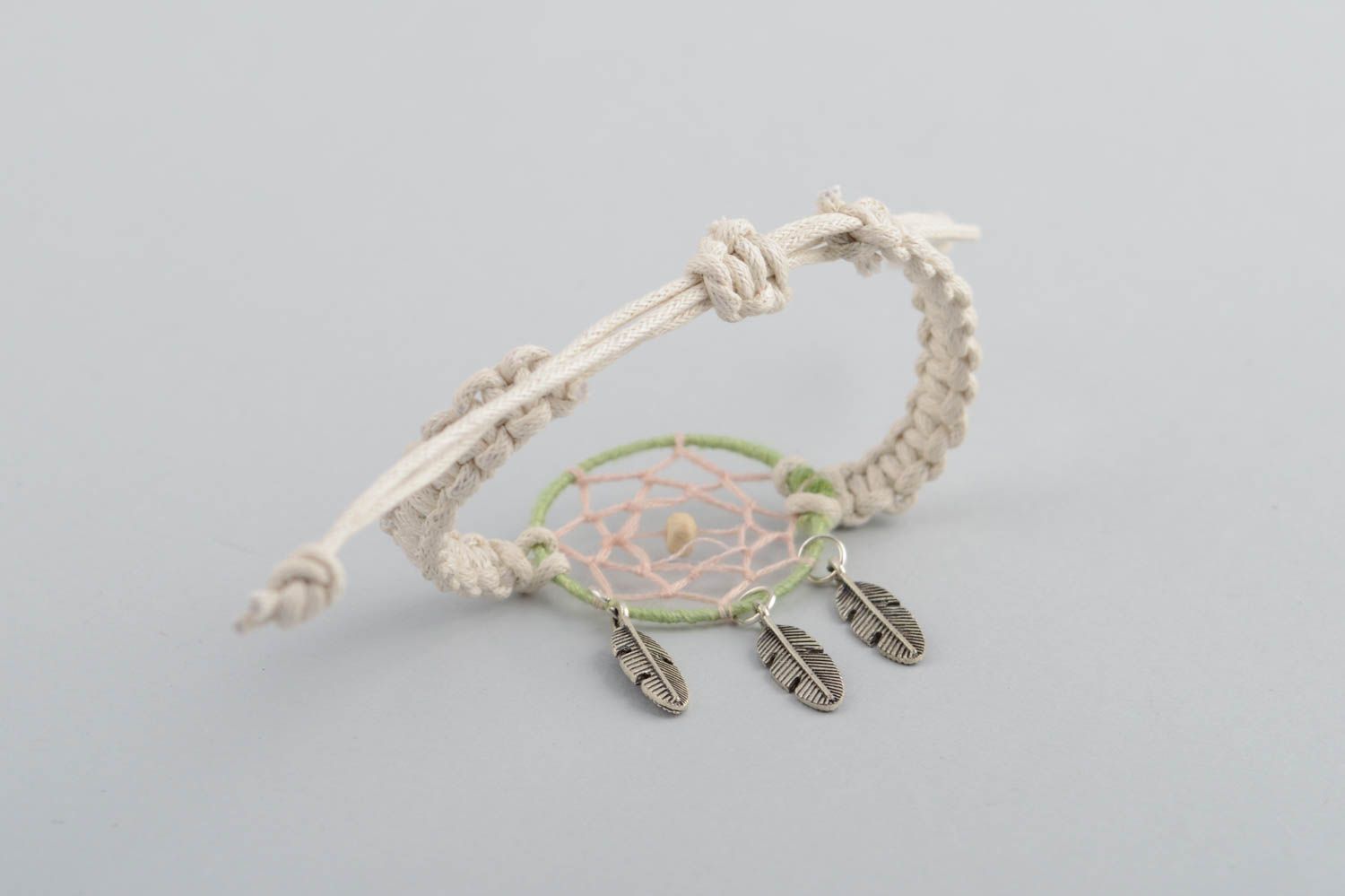 Handmade light macrame woven cord wrist bracelet with dreamcatcher and charms photo 5