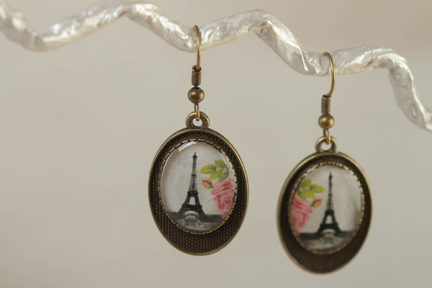 Handmade oval metal earring with Eiffel tower image coated with glass glaze photo 1