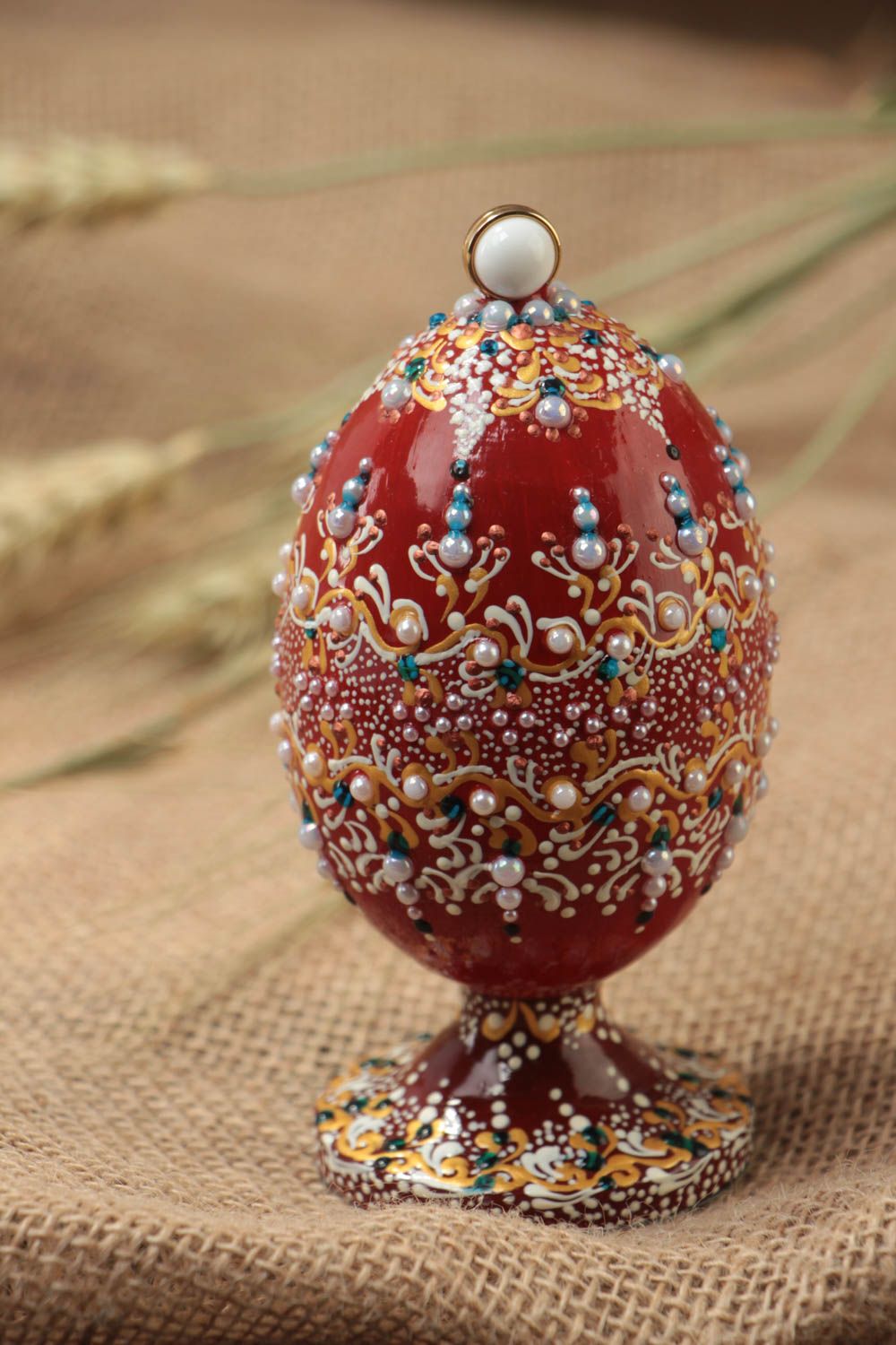 Handmade interior decorative wooden painted egg on stand decorated with beads photo 1