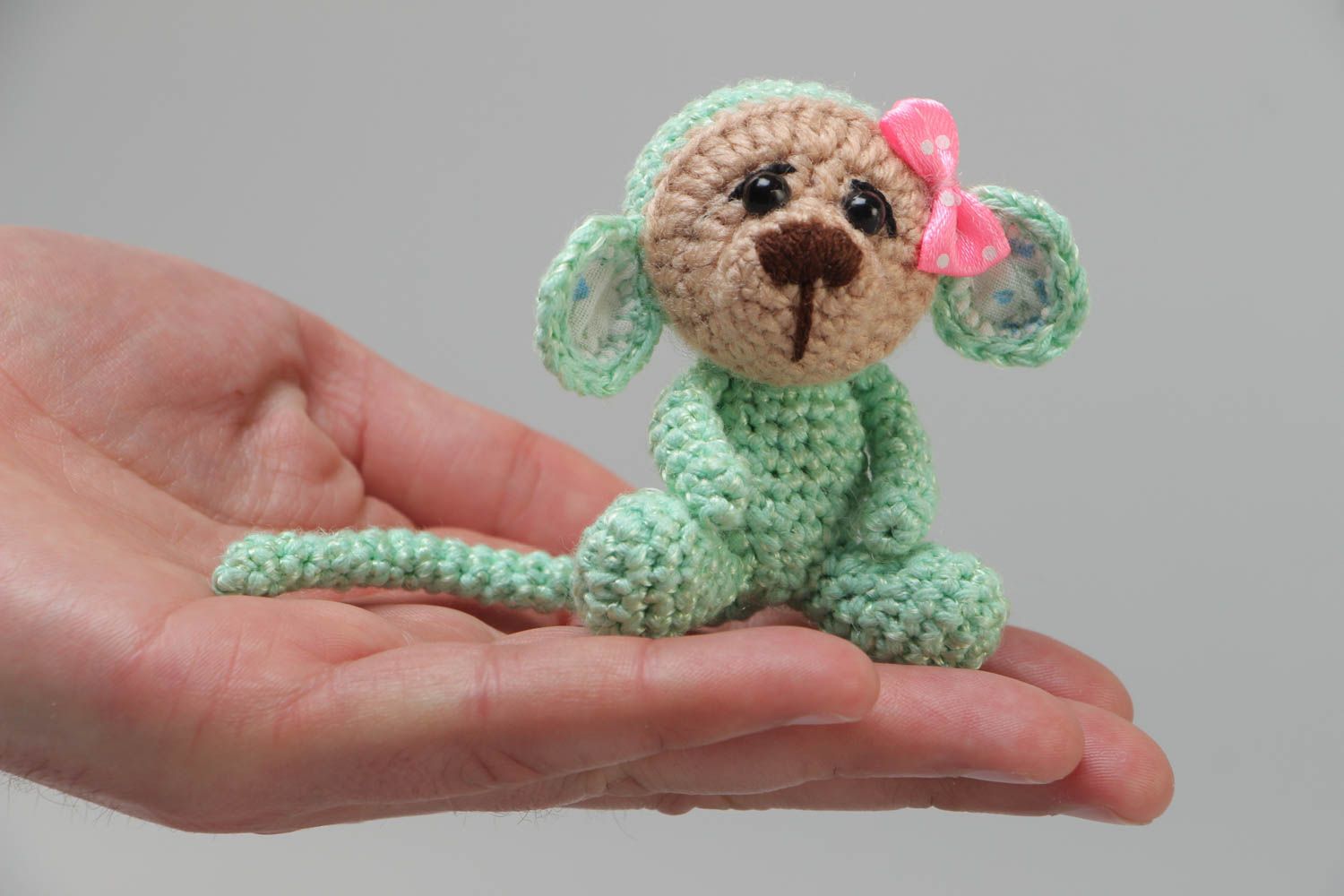 Handmade small funny soft toy crocheted of acrylic threads Green Monkey with bow photo 5