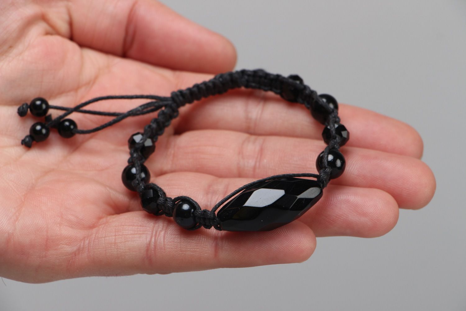 Black designer bracelet hand made of beads and cord photo 3