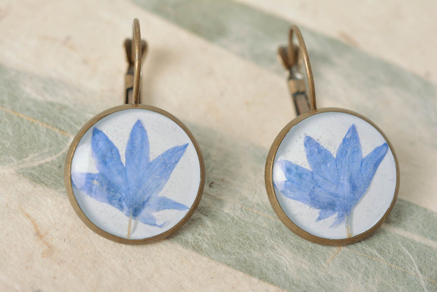 Beautiful homemade earrings with dried flowers coated with epoxy photo 4
