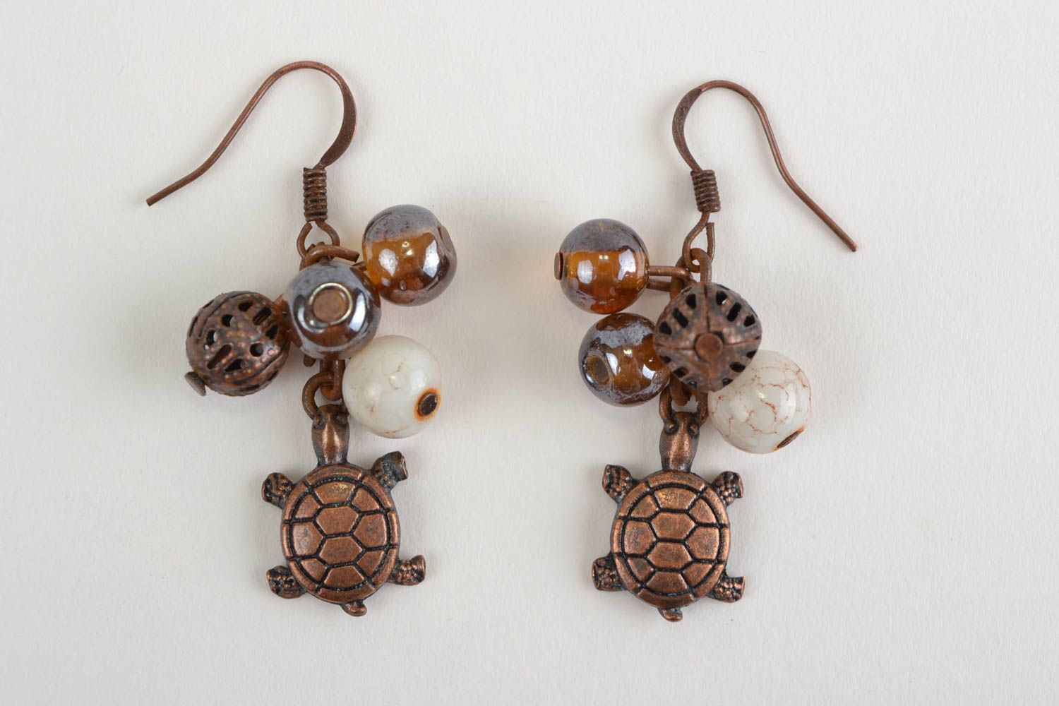 Handmade designer brown dangling earrings with glass beads and turtle charms photo 3