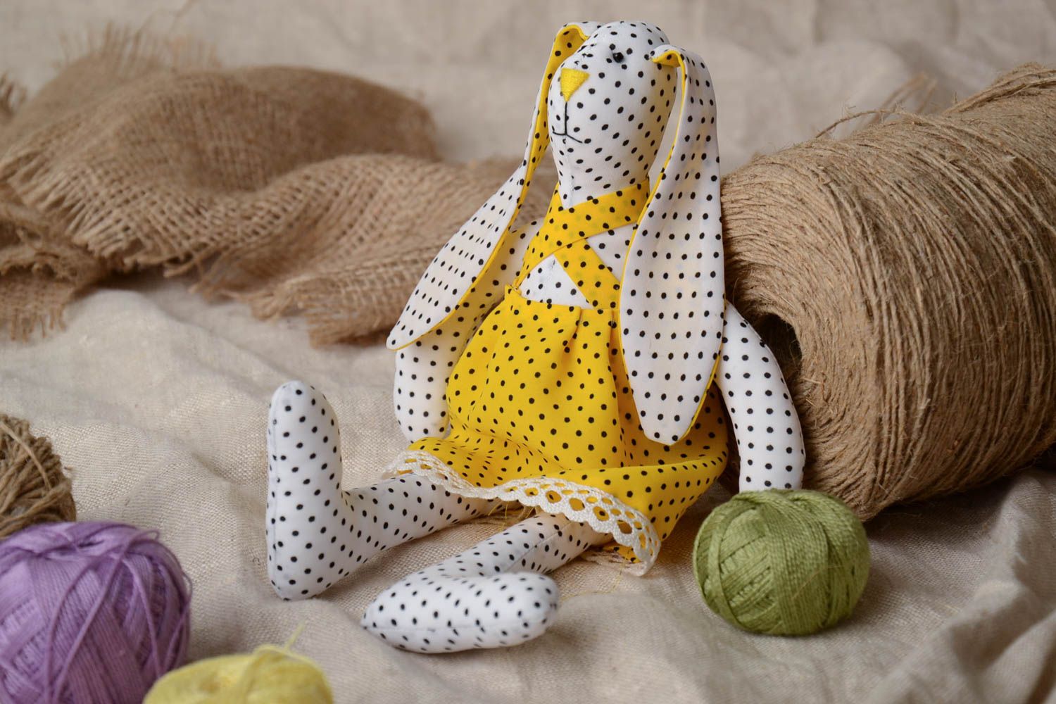 Handmade soft toy sewn of staple fabric rabbit in bright yellow dress with lace photo 1