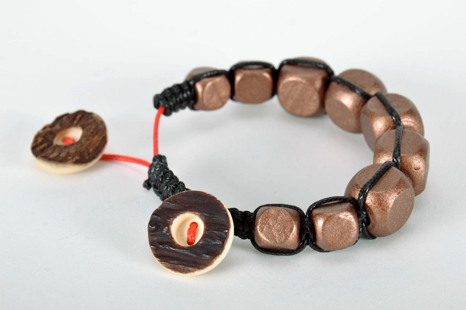 Bracelet made of wooden beads and plastic buttons photo 4