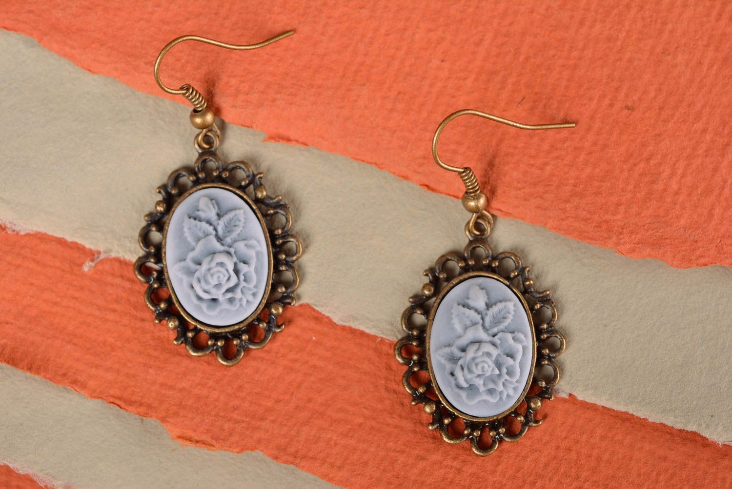 Handmade designer polymer clay cameo oval dangling earrings with metal frame photo 1