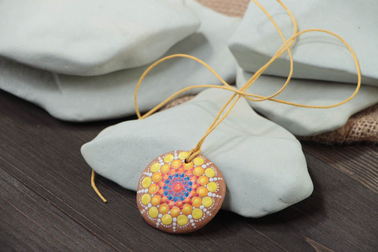 Unusual handmade designer ceramic round pendant with bright dot painting on cord photo 1