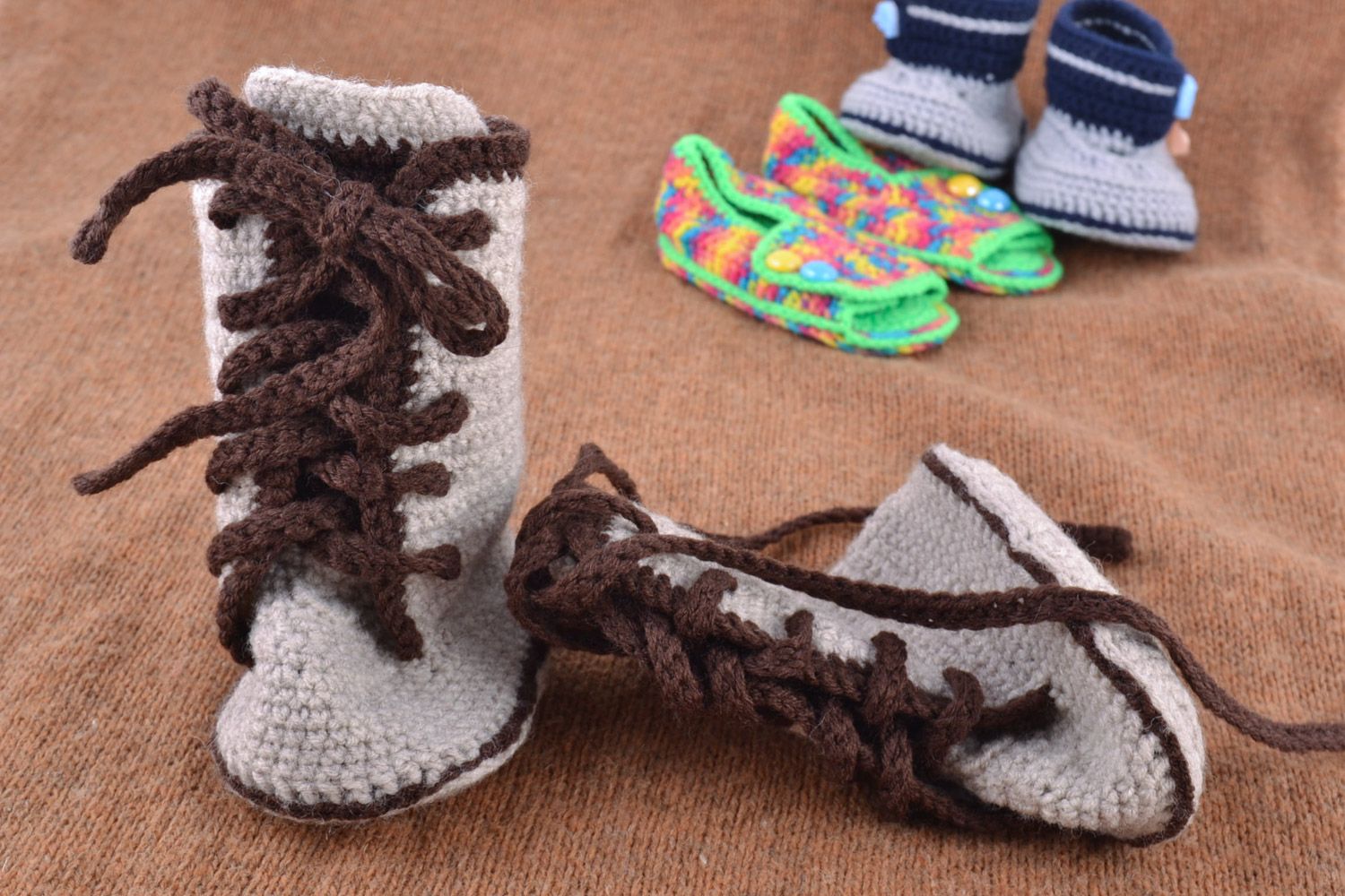 Handmade gray baby booties crocheted of semi-woolen threads with lacing photo 1