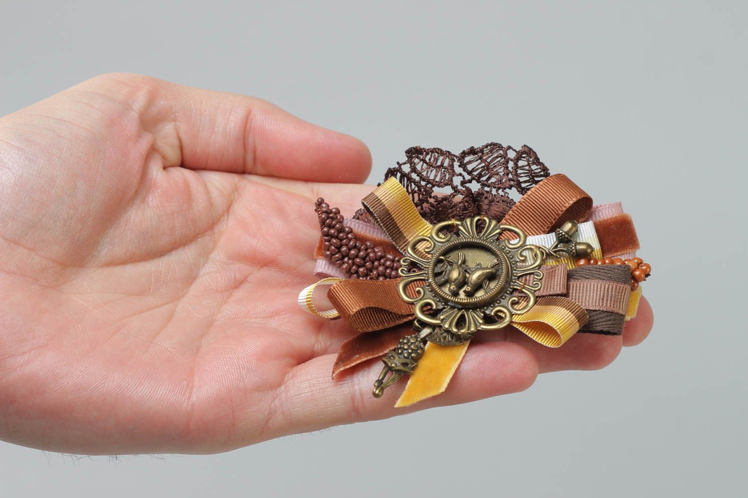 Handmade rep ribbon brooch with lace and charms in brown color palette photo 5