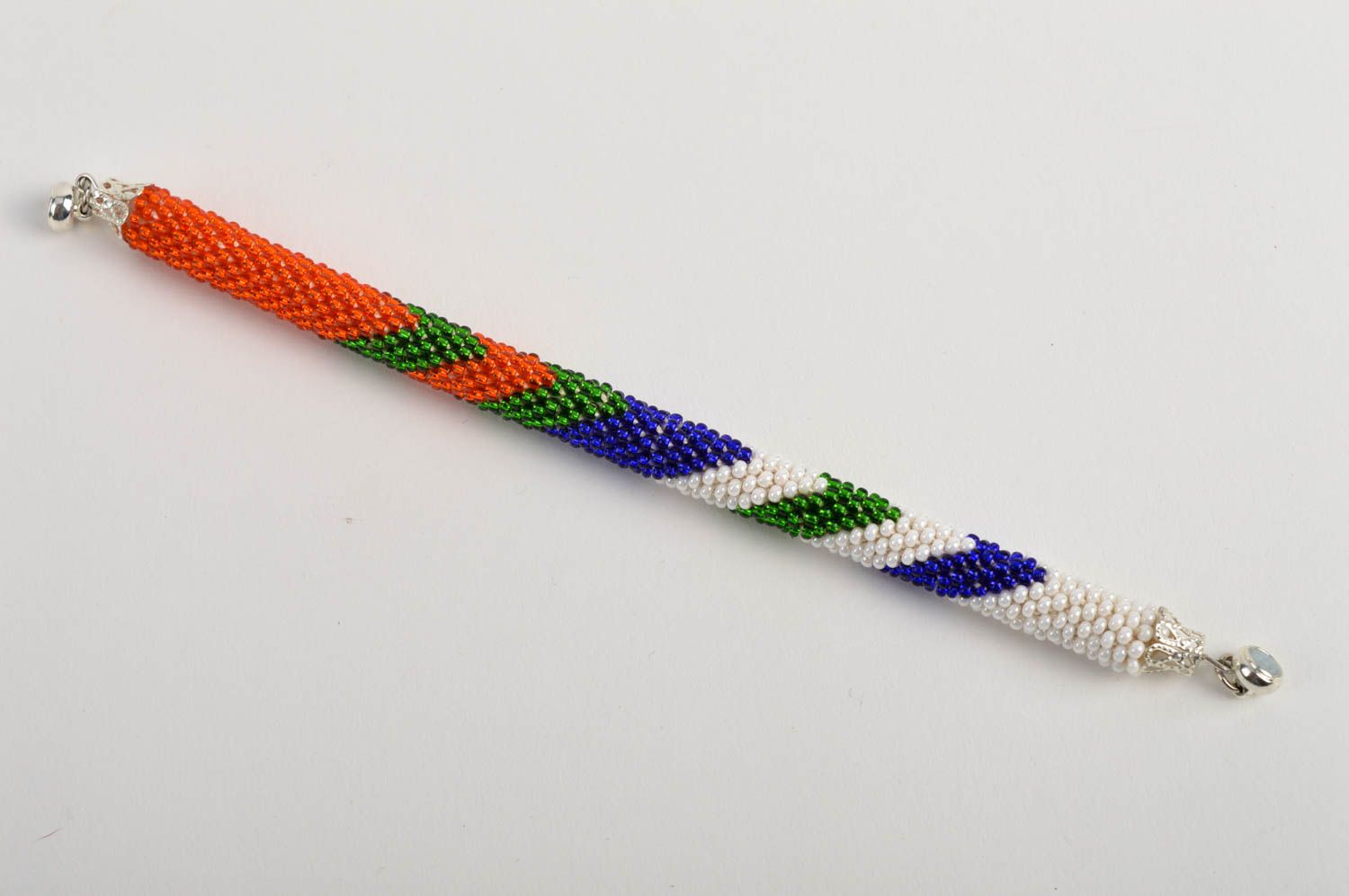 Bright handmade beaded bracelet in red, white, green, blue colors photo 5
