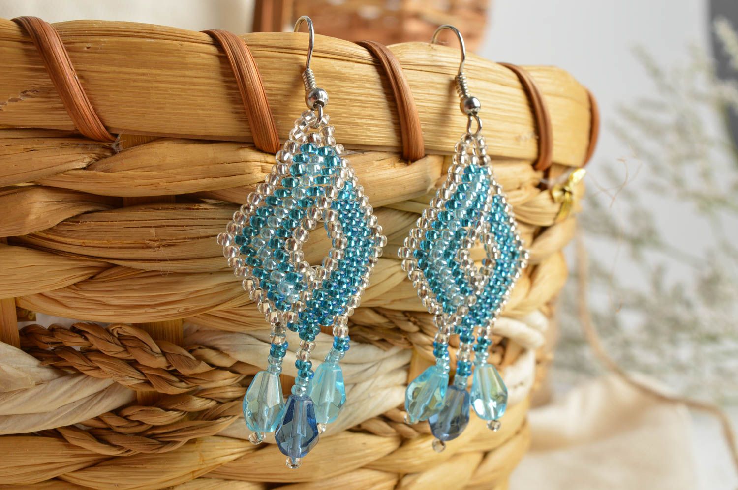 Handmade bead woven dangle earrings in the shape of rhombus of light blue color photo 1