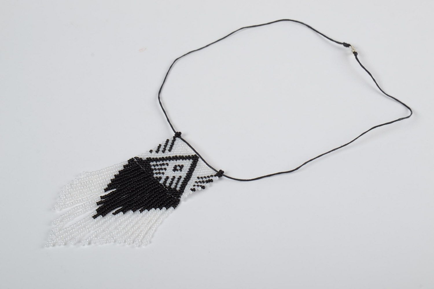 Black and white handmade beaded pendant with fringe and synthetic cord photo 2