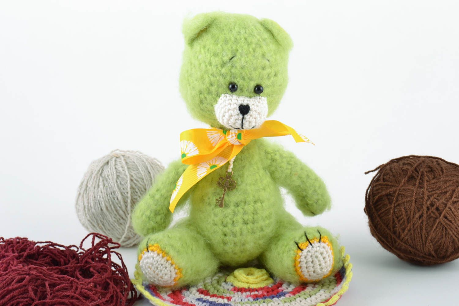 Handmade small toy Bear crochet of wool of lime color photo 1
