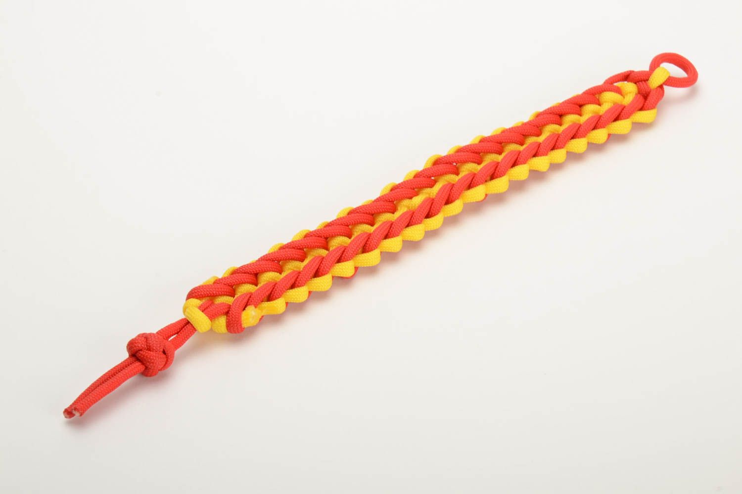 Red and yellow handmade wrist bracelet woven of American paracord photo 4